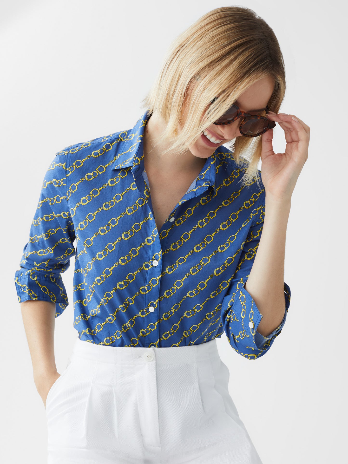 Model wearing J.McLaughlin Lois shirt in medium blue/gold made with cotton.