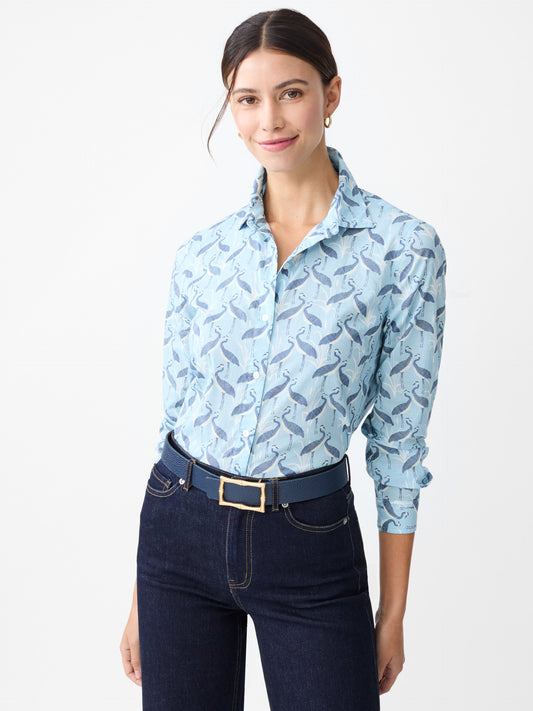 Model wearing J.McLaughlin Lois shirt in light blue/navy made with cotton.