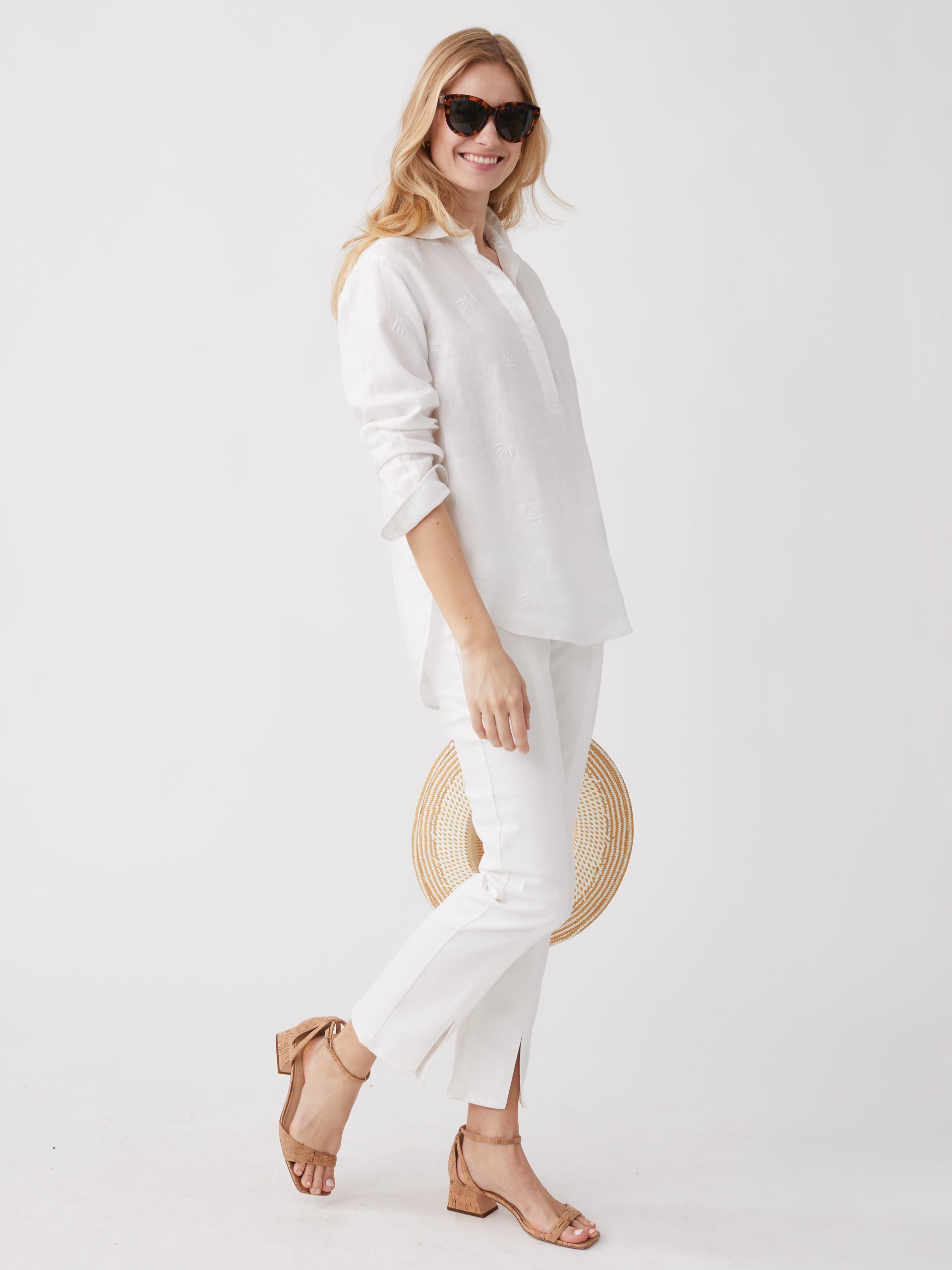 Model wearing J.McLaughlin Lula shirt in white made with linen.
