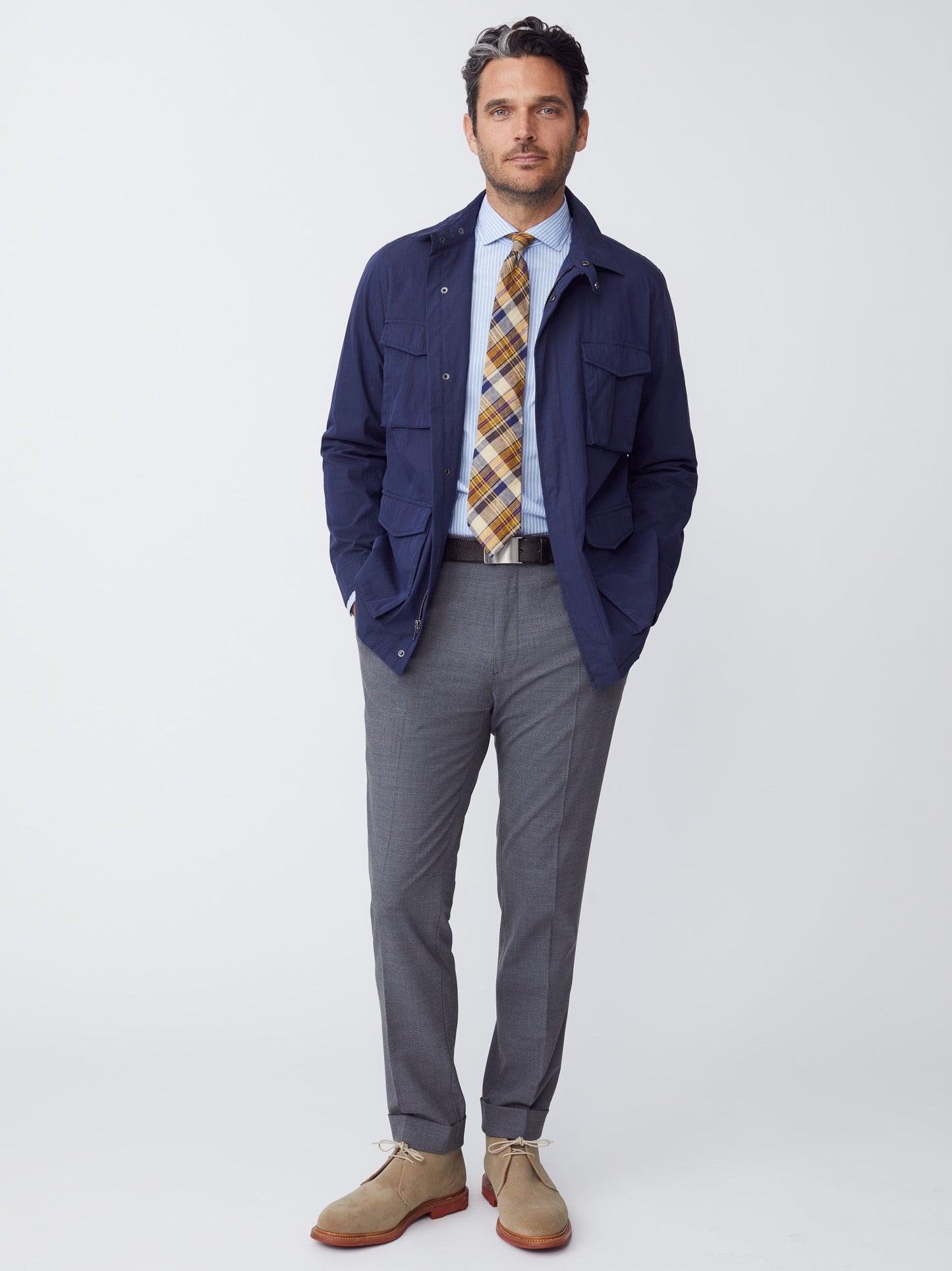 Model wearing J.McLaughlin Madaket safari jacket in navy made with cotton/nylon.