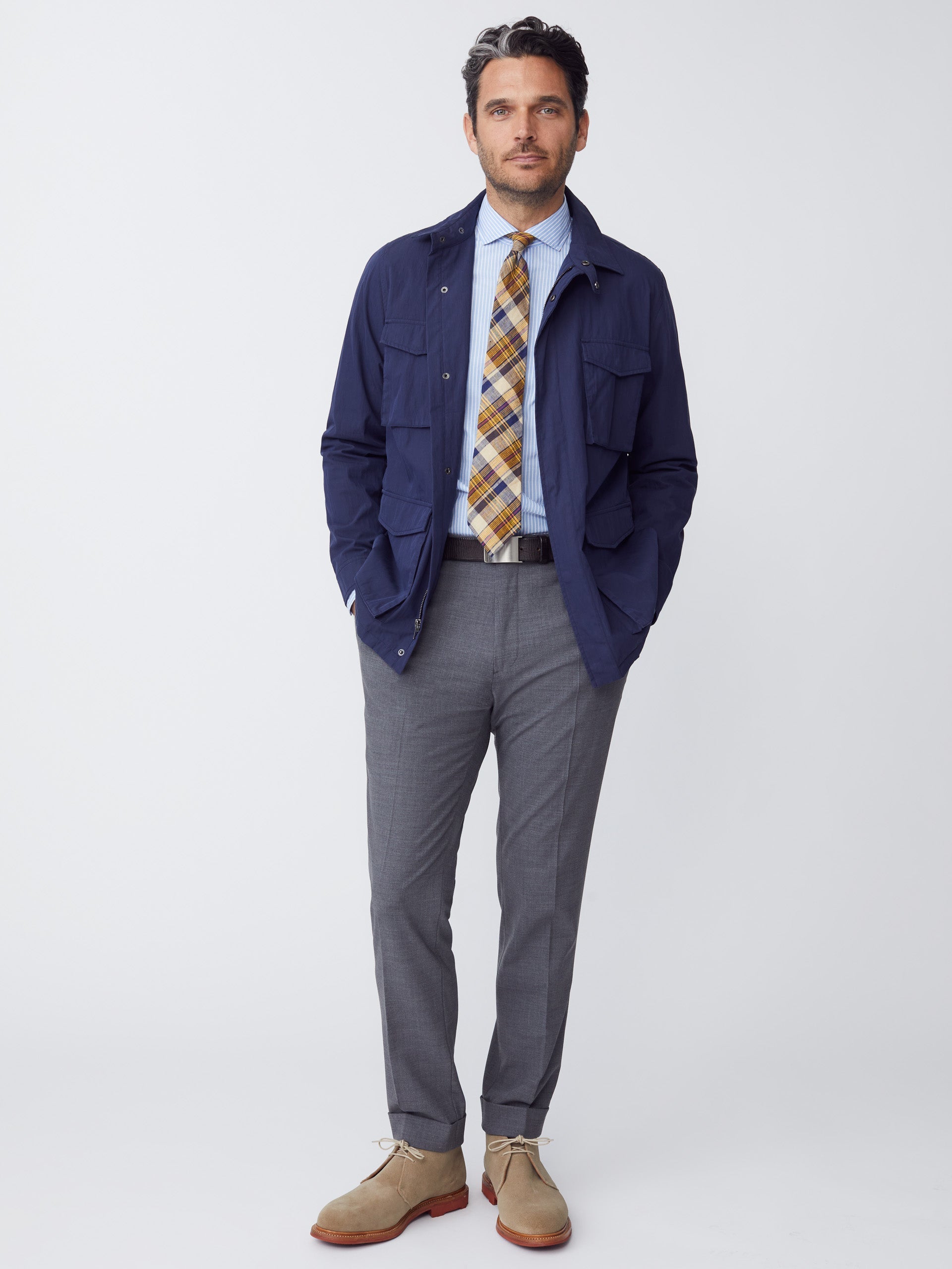 Model wearing J.McLaughlin Madaket safari jacket in navy made with cotton/nylon.