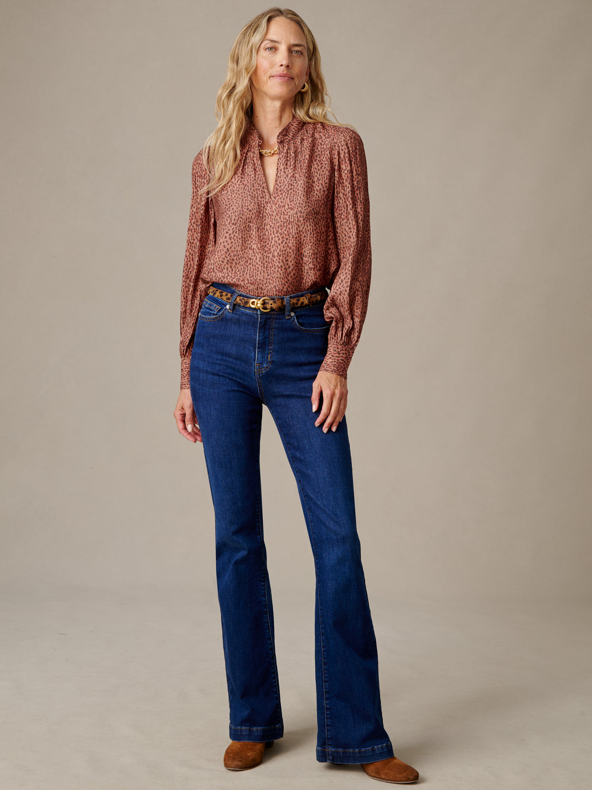 J.McLaughlin Maeve Silk Blend Blouse in Leopardette worn with flared jeans featuring raglan sleeves and a stand collar