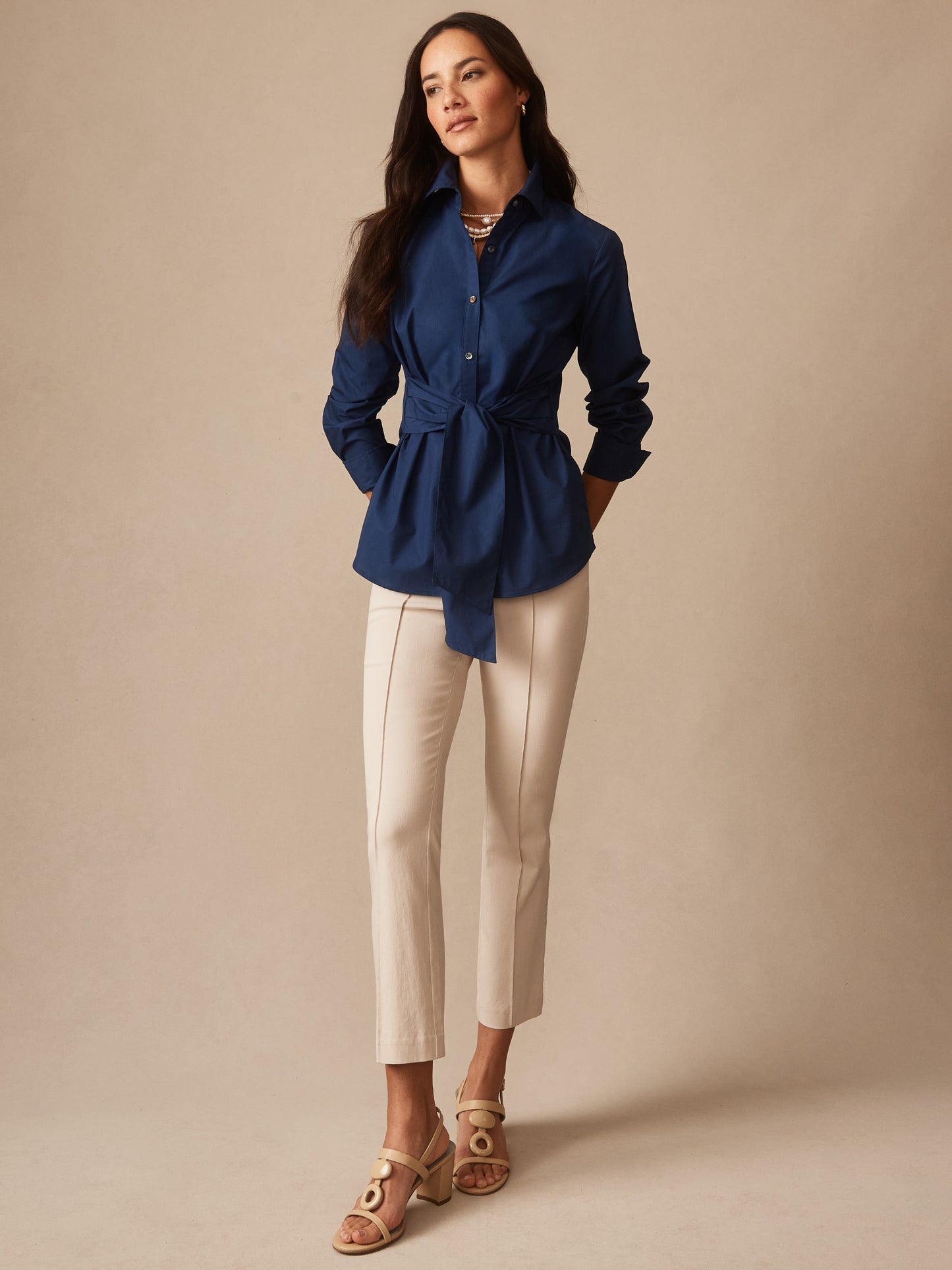 Model wearing J.McLaughlin Ivy pants in stone made with Amelia cloth.