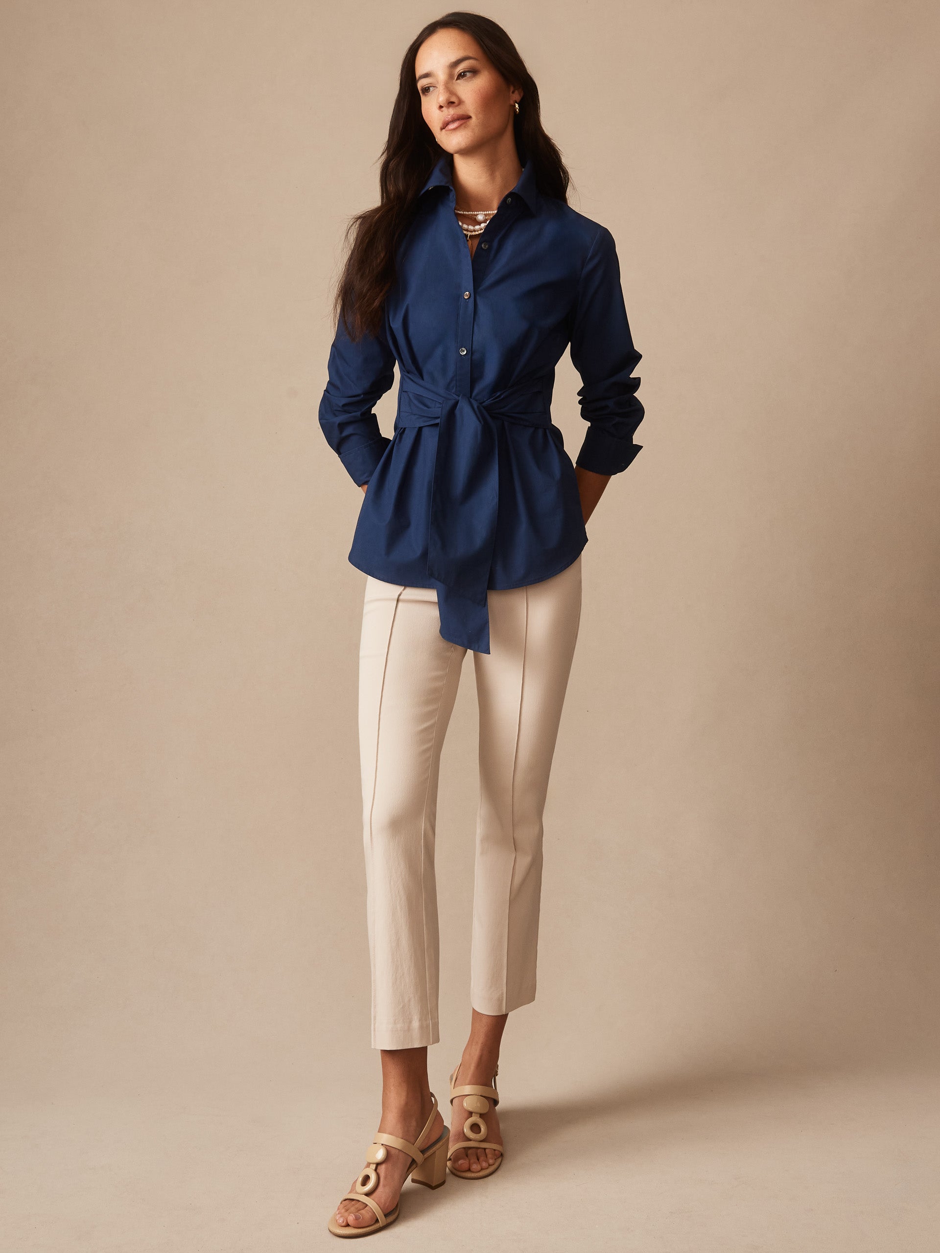 Model wearing J.McLaughlin Ivy pants in stone made with Amelia cloth.