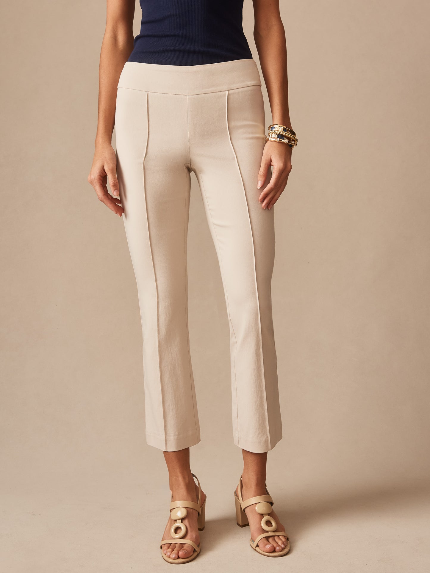 Model wearing J.McLaughlin Ivy pants in stone made with Amelia cloth.