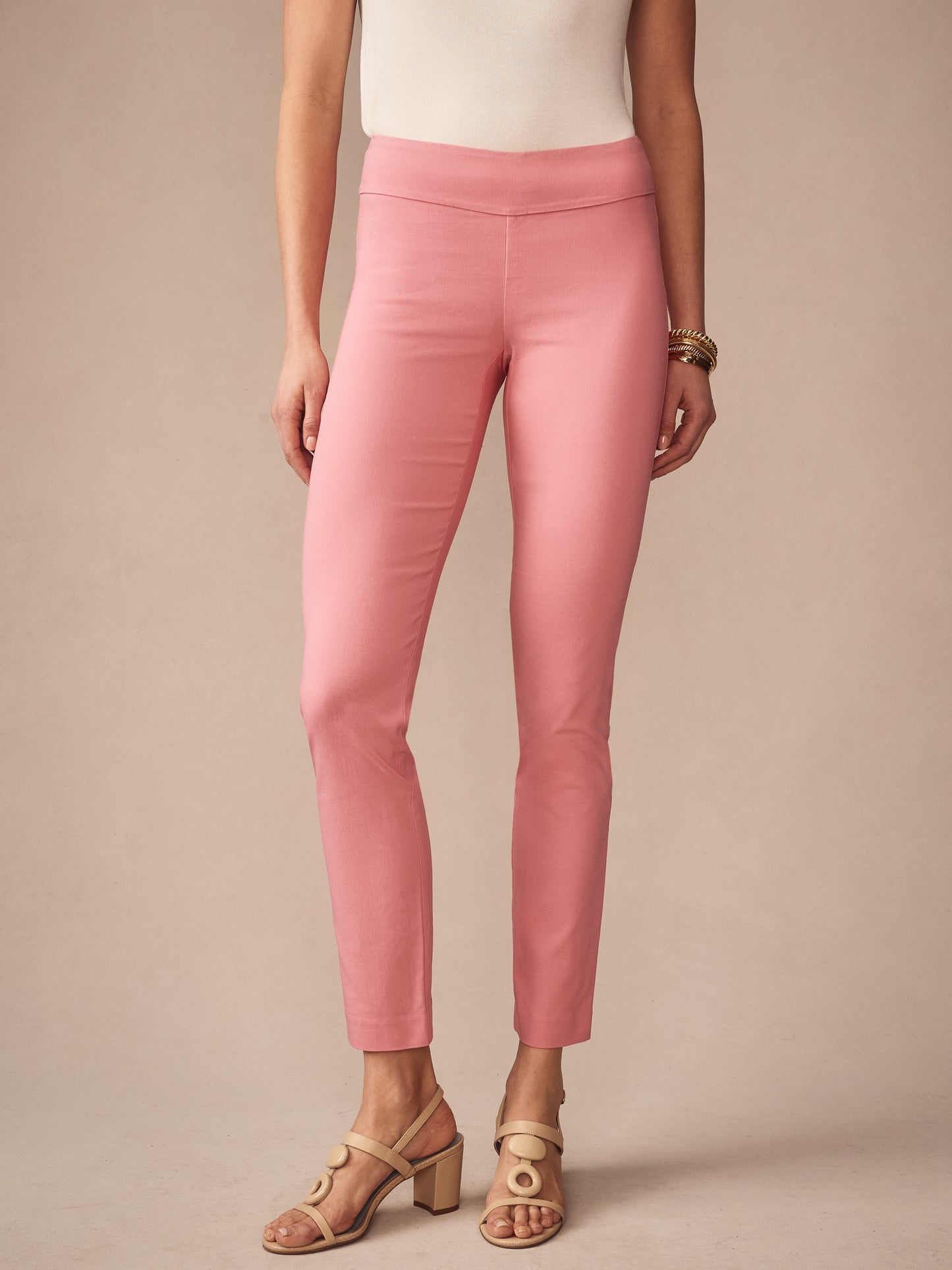 A model showcases J.McLaughlin Masie Pants in soft pink, highlighting effortlessly stylish, enduring designs crafted from innovative fabrics—a destination for defining style. Life, Well-Lived.