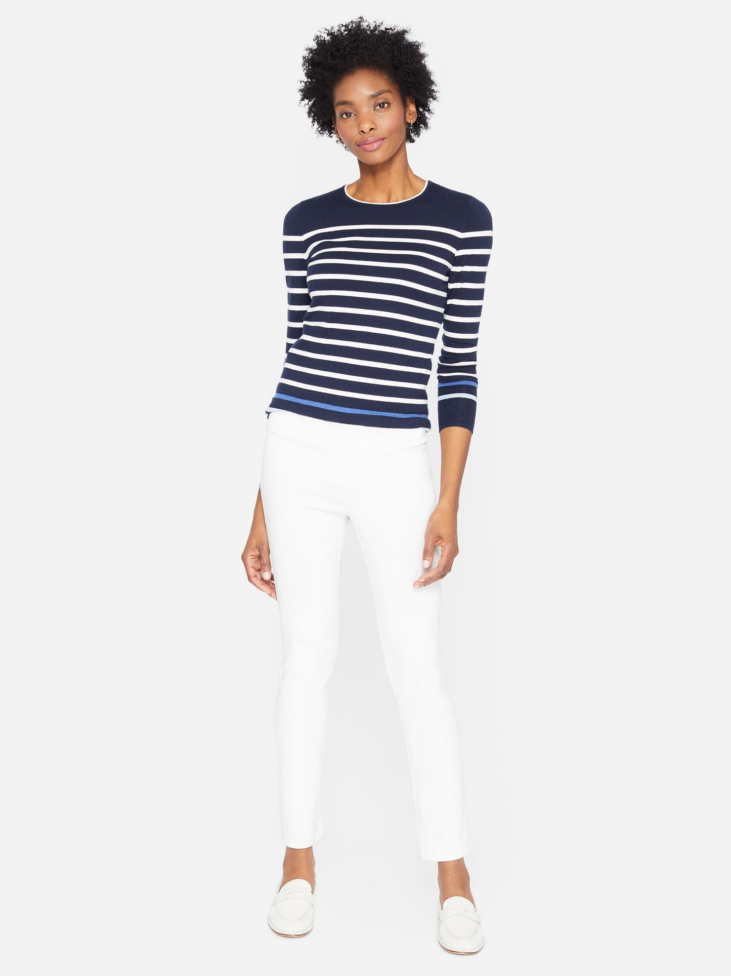Model wearing J.McLaughlin Masie pants in white made with Amelia cloth.
