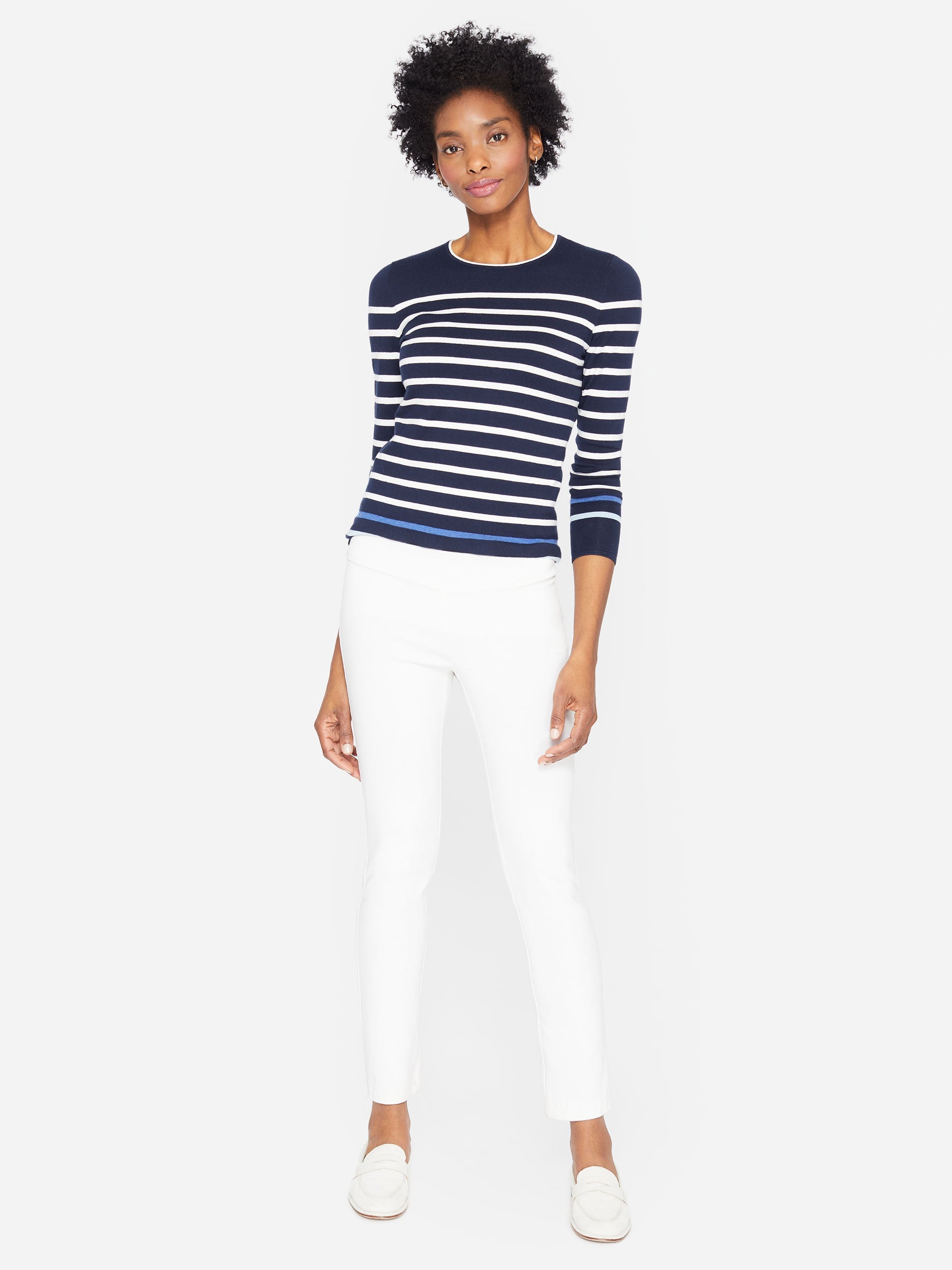 Model wearing J.McLaughlin Masie pants in white made with Amelia cloth.