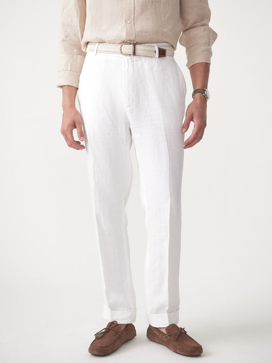 Model wearing J.McLaughlin Oxford pants in white made with herringbone linen.