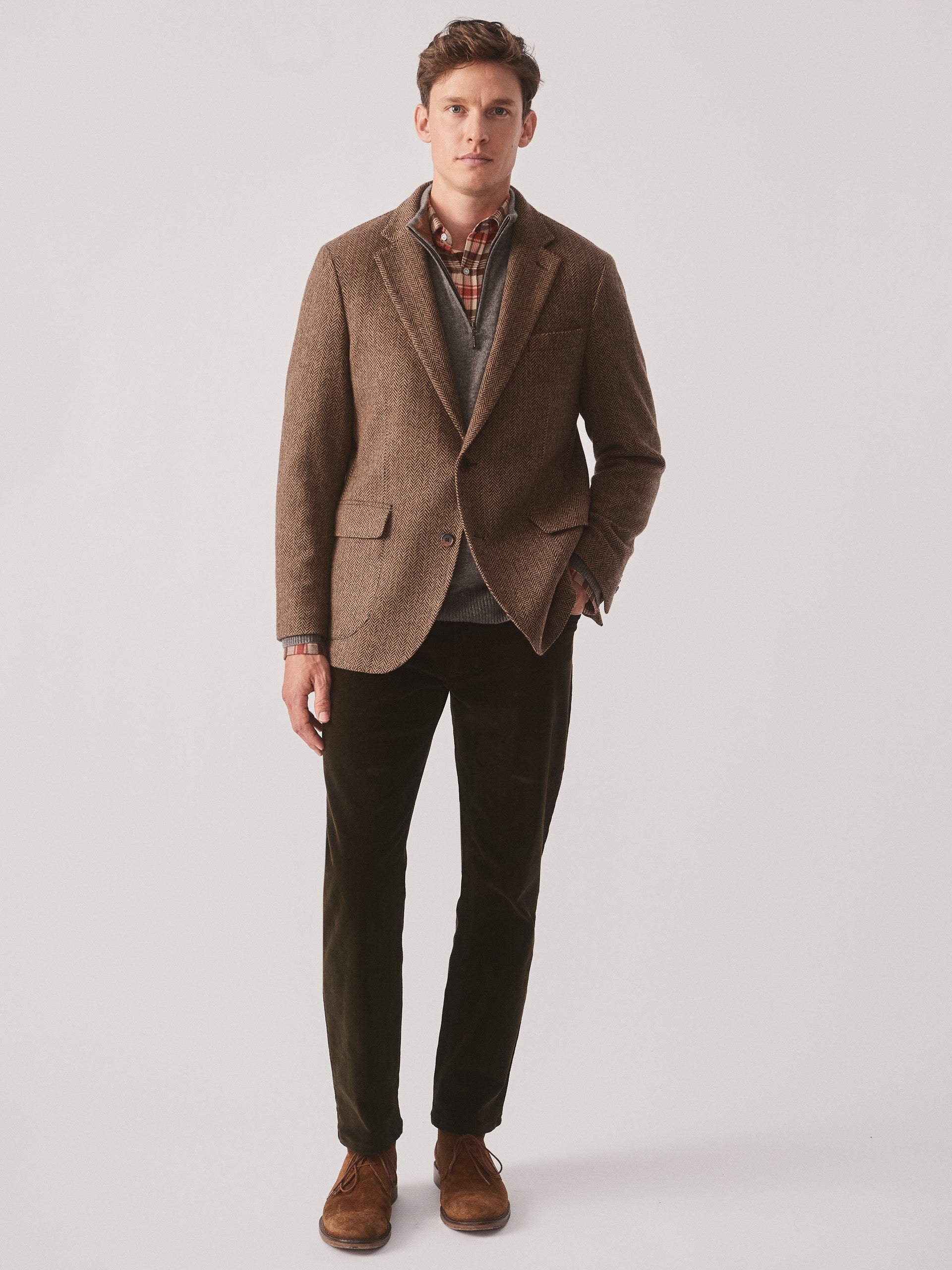 Model wearing J.McLaughlin McCown blazer in beige/brown made with wool.