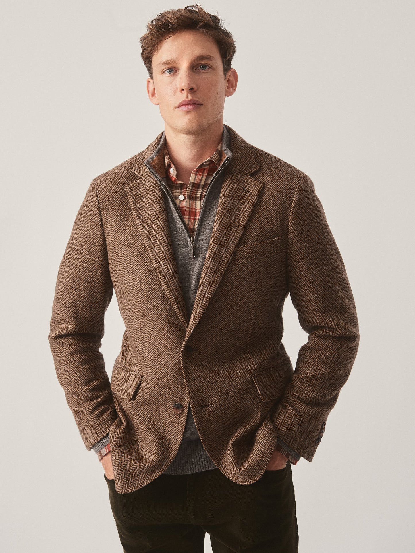 Model wearing J.McLaughlin McCown blazer in beige/brown made with wool.