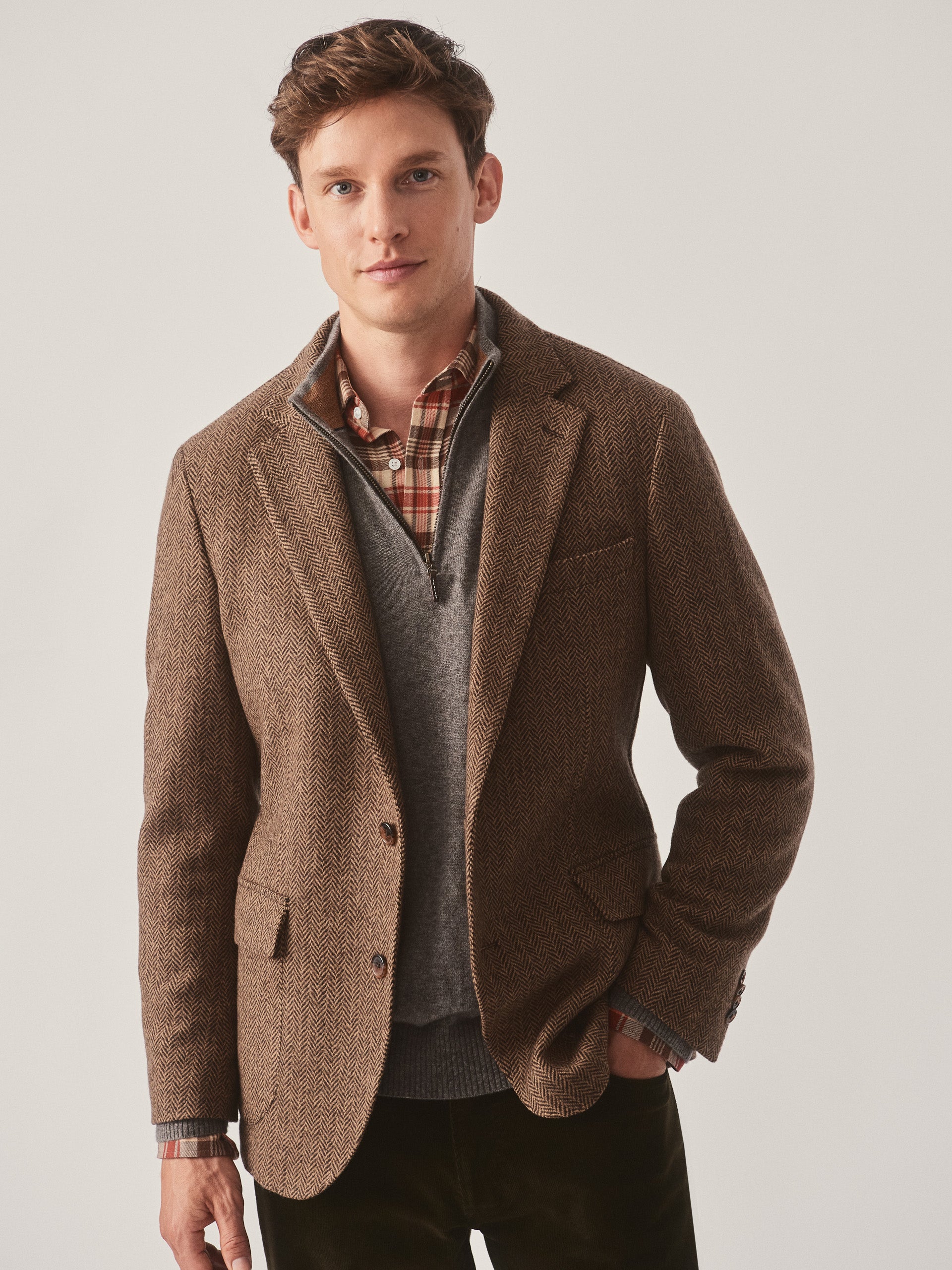 Model wearing J.McLaughlin McCown blazer in beige/brown made with wool.