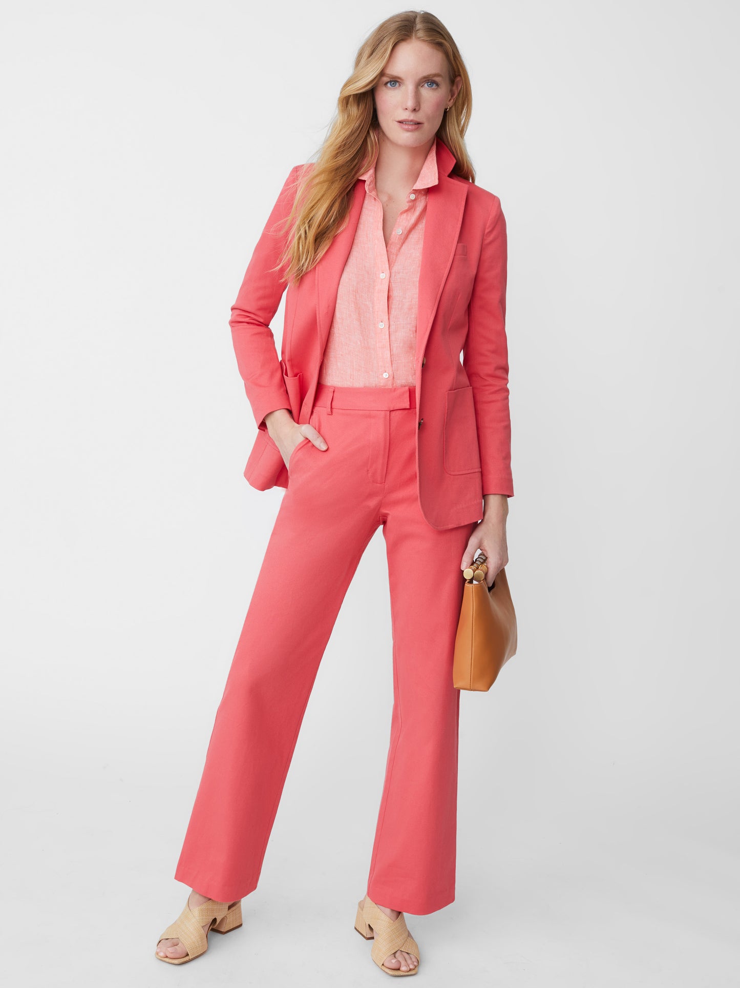 Model wearing J.McLaughlin Brock pants in rose made with cotton twill.