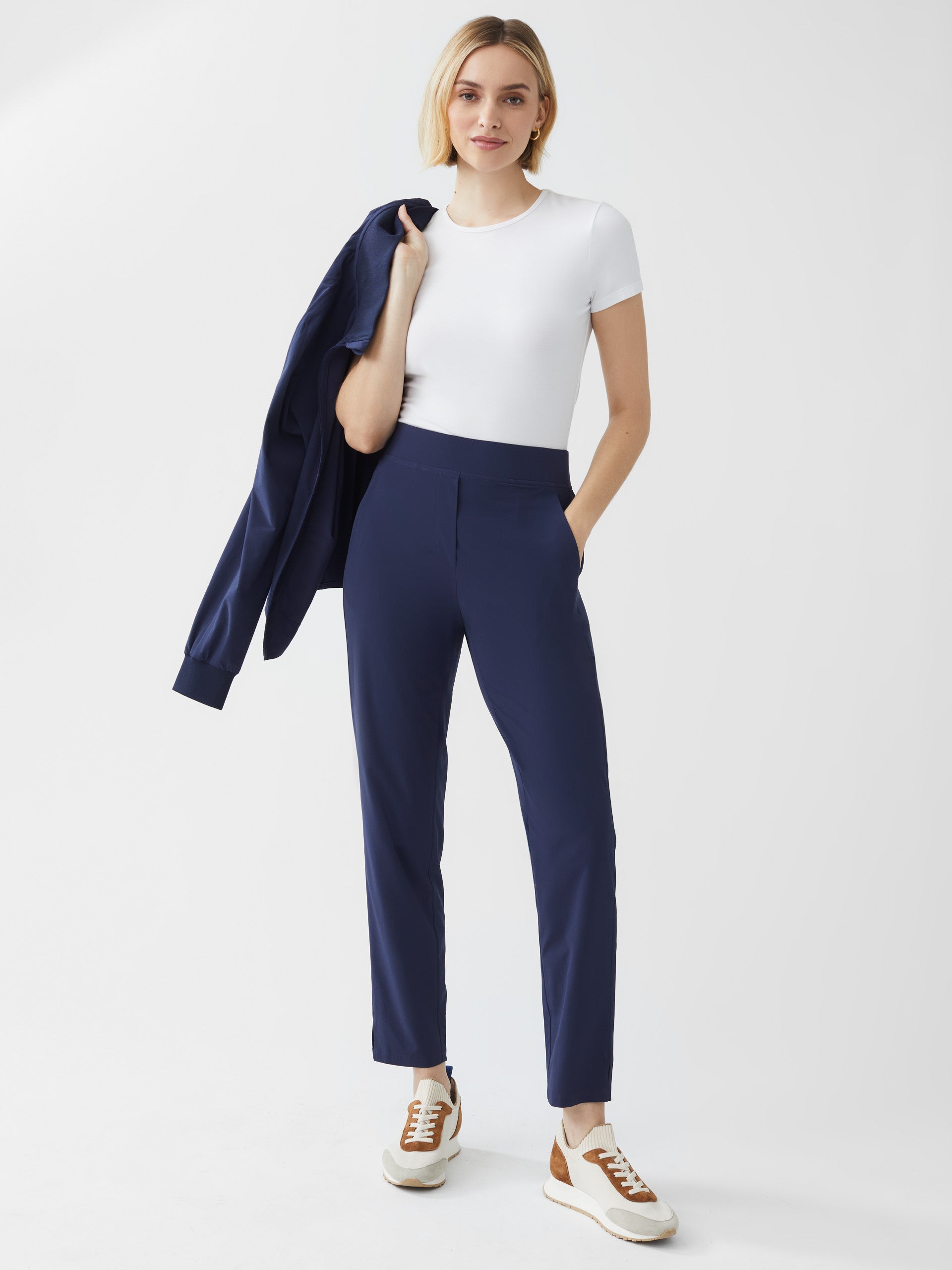 Model wearing J.McLaughlin Beasley pants in navy made with polyester/spandex.