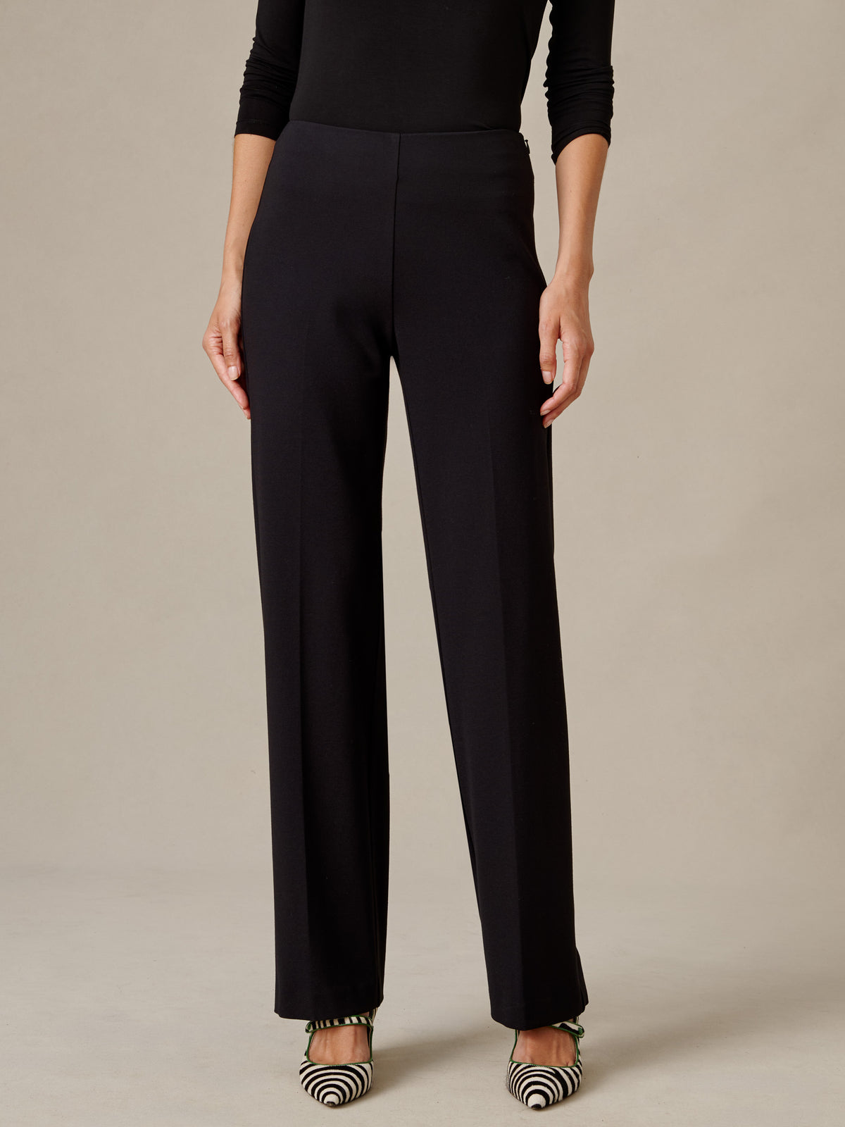 J.McLaughlin Carter Pants in black with a fluid wide leg silhouette styled with a fitted top and striped heels for effortlessly polished everyday dressing