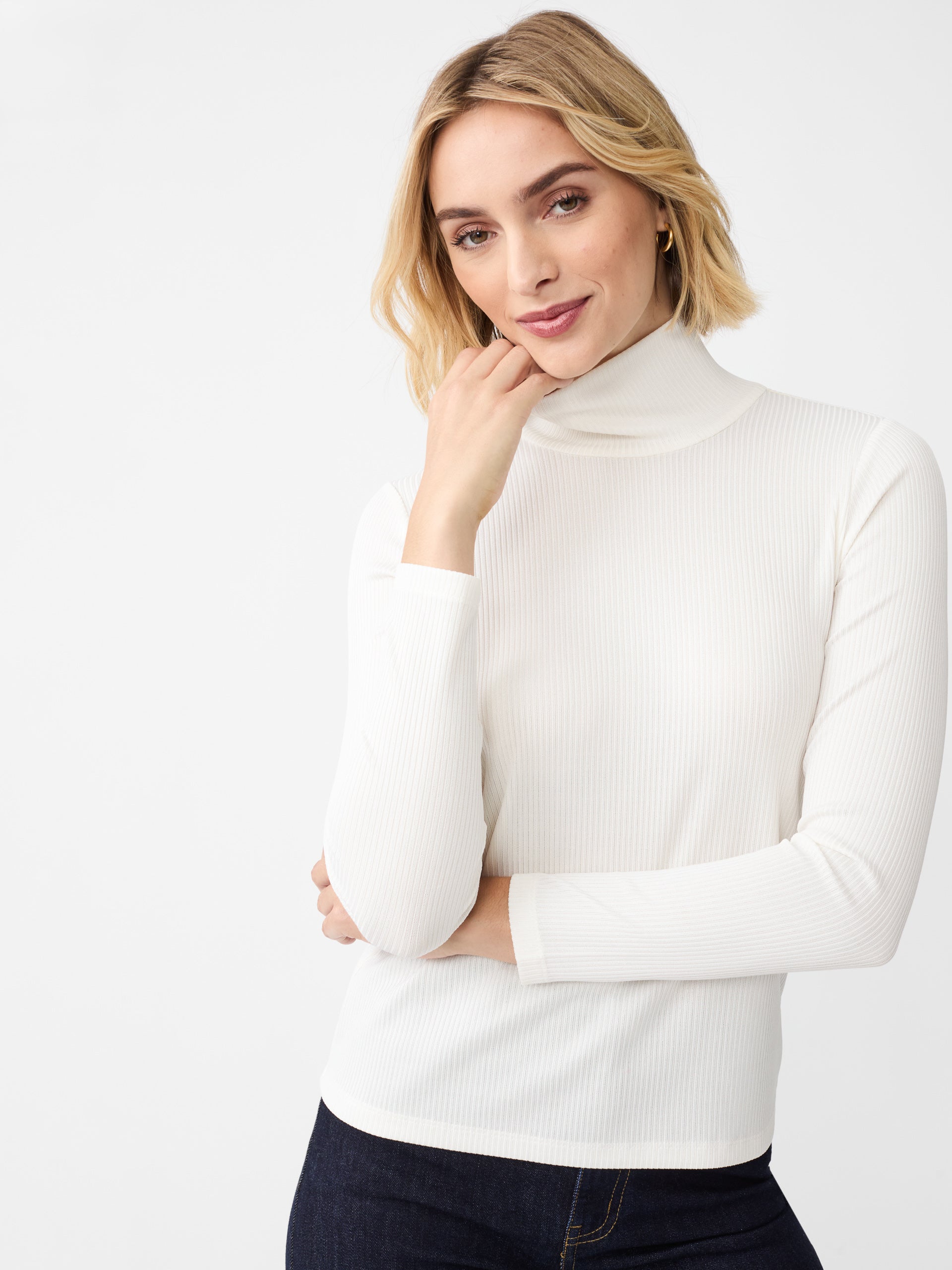 J.McLaughlin Nadia turtleneck in cream/silver made with metallic ribbed knit fabric.