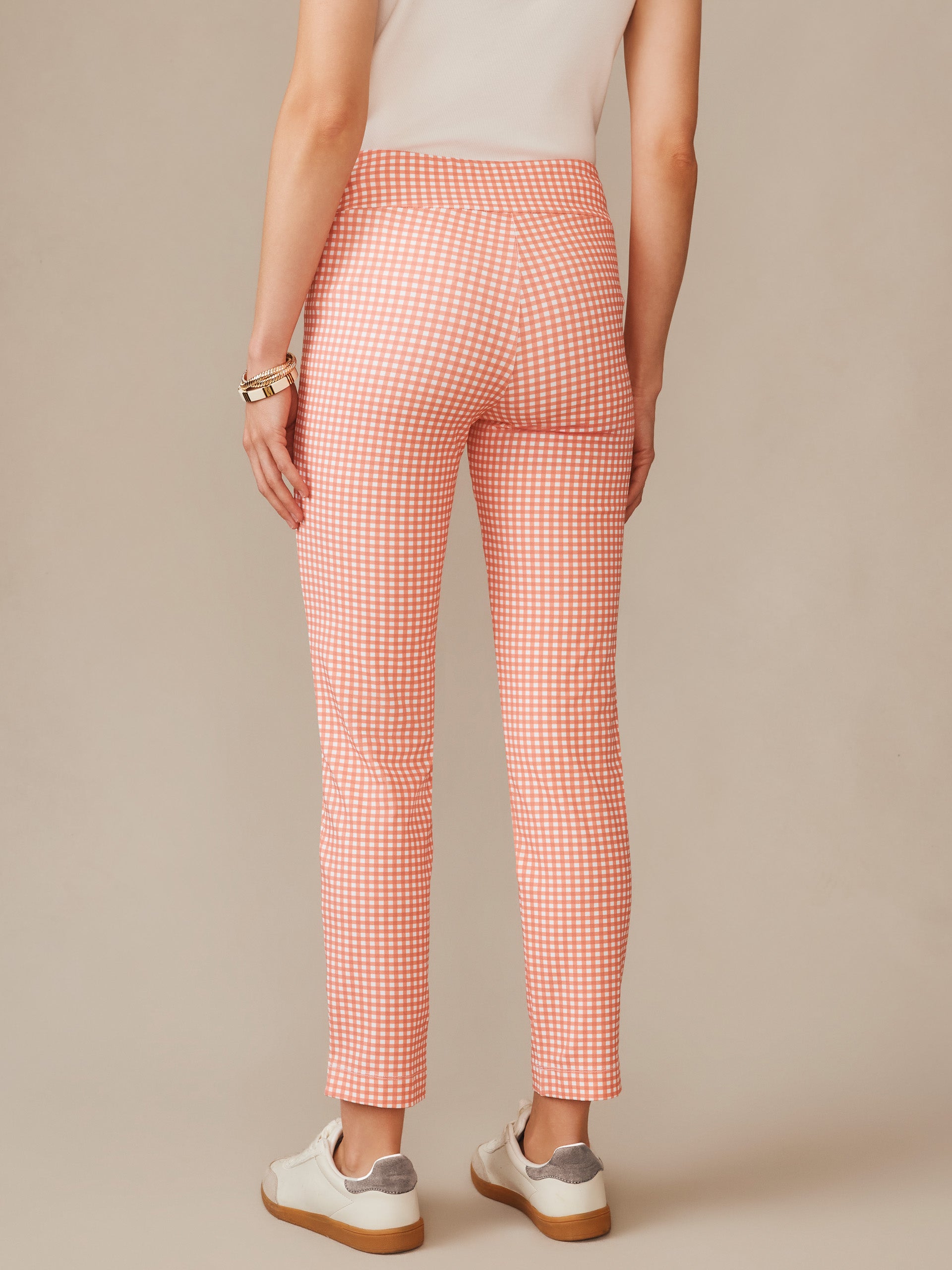 A rear view of a model wearing Newport Capri Pants in Midi Cabana Gingham by J.McLaughlin, showcasing effortlessly stylish, enduring designs with innovative fabrics—a destination for defining style. Life, Well-Lived.