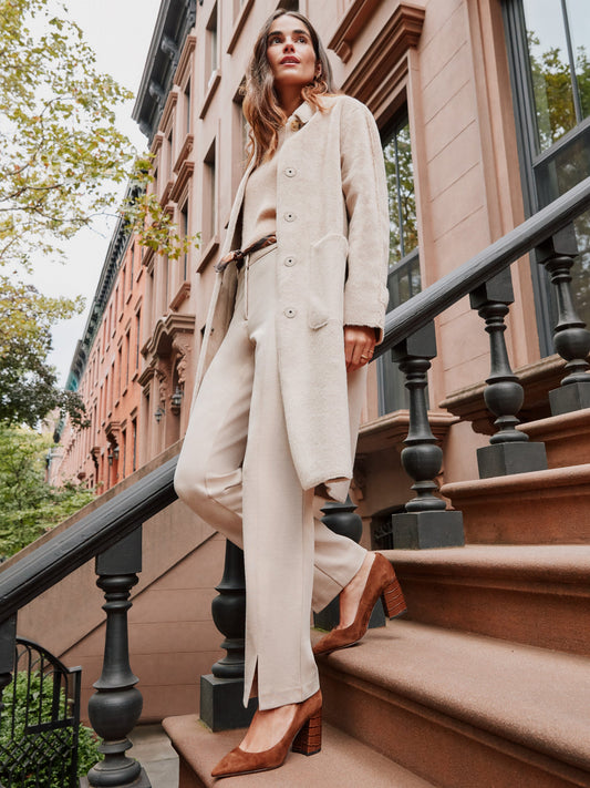 Model wearing J.McLaughlin Deanne pants in heather sand made with Bainbridge fabric.