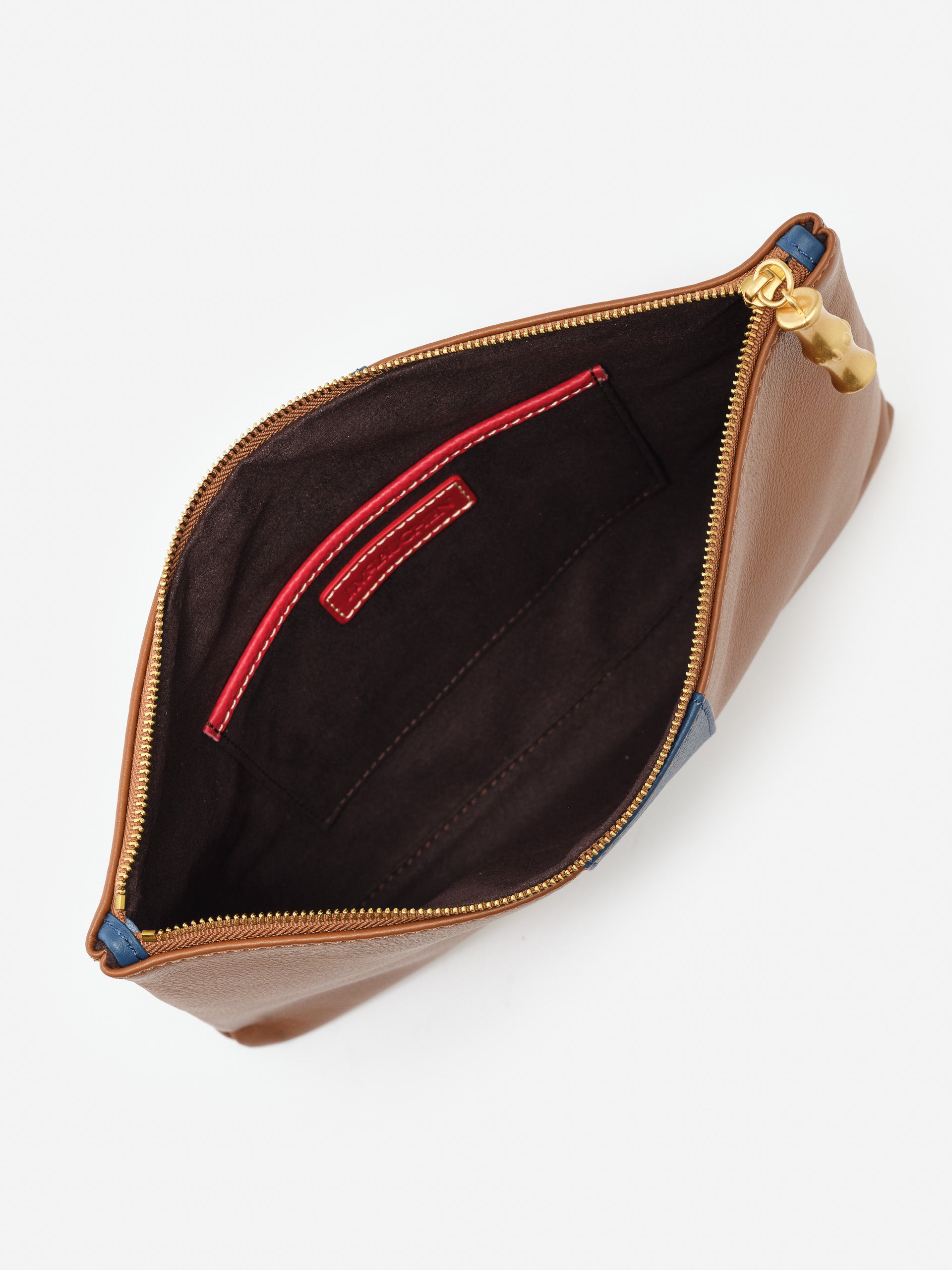 J.McLaughlin Willow clutch in tobacco/navy made with leather.