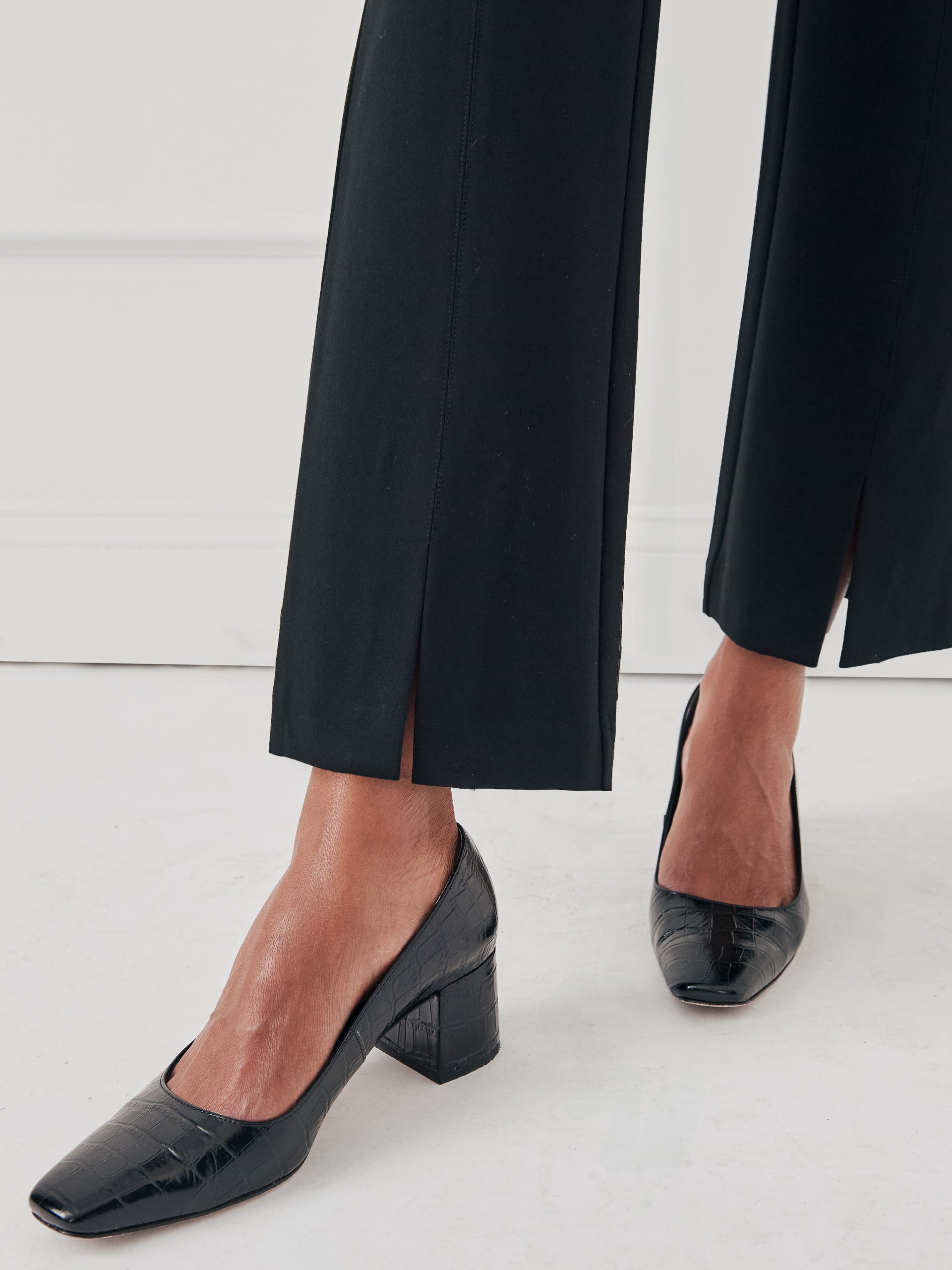 Model wearing J.McLaughlin Deanne pants in black made with Bainbridge fabric.