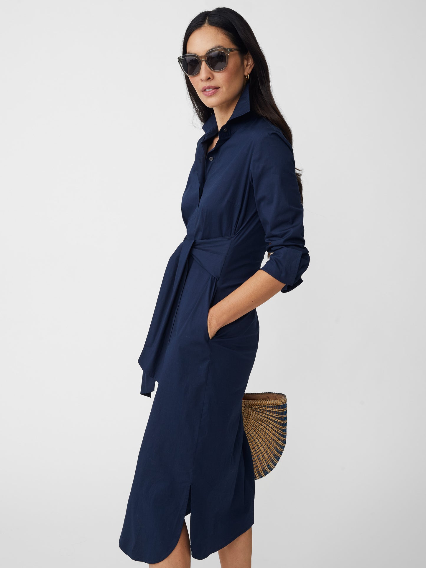 Model wearing J.McLaughlin Orla dress in navy made with cotton/nylon/elastane.