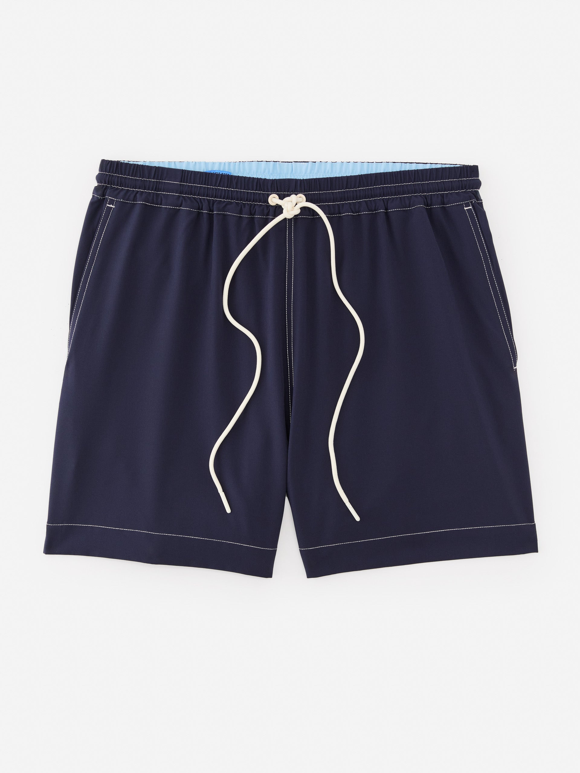J.McLaughlin Outrigger swim trunks in navy made with polyester and spandex.