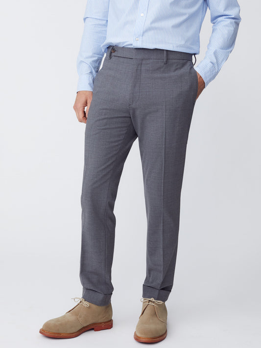 Model wearing J.McLaughlin Oxford pants in heather charcoal made with wool/elastane.