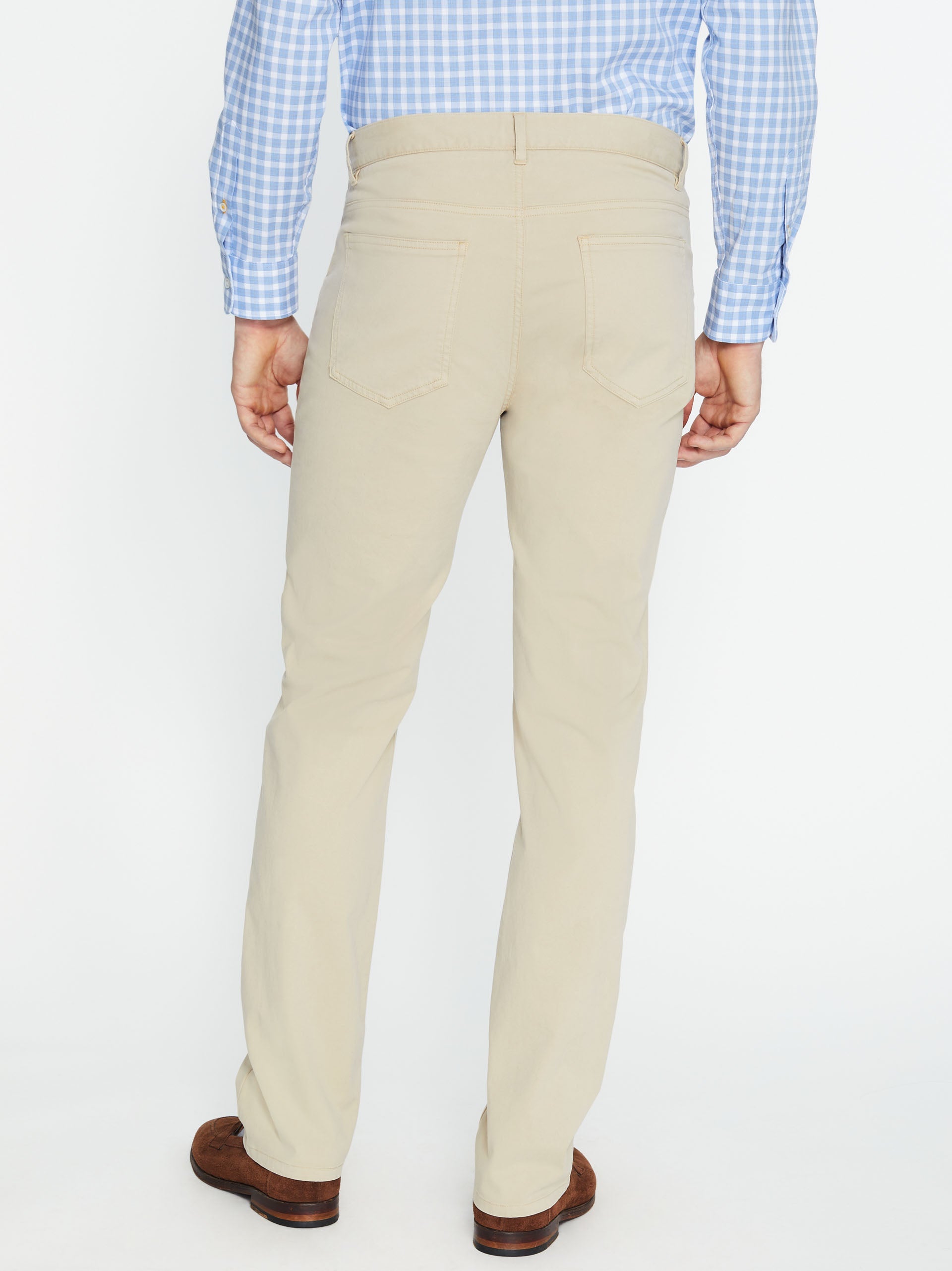 Model wearing J.McLaughlin Parker pants in stone made with cotton/spandex.