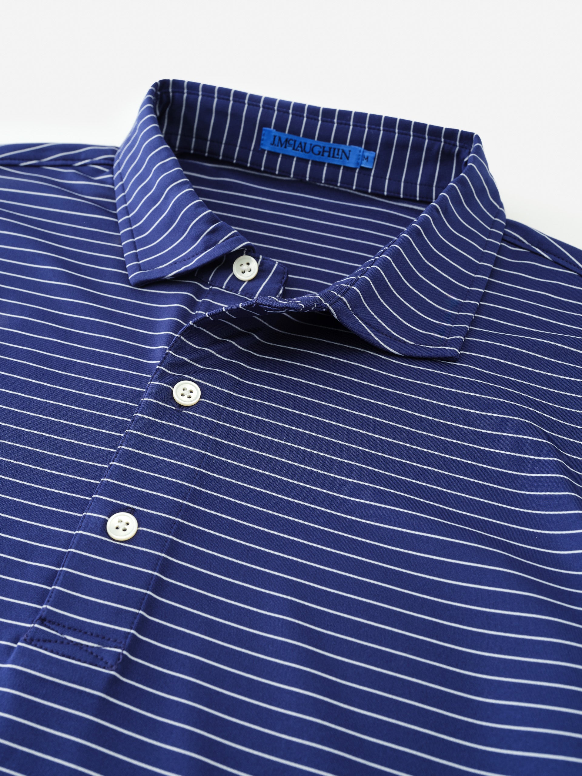 J.McLaughlin Peak performance polo in navy/white made with nylon/spandex.