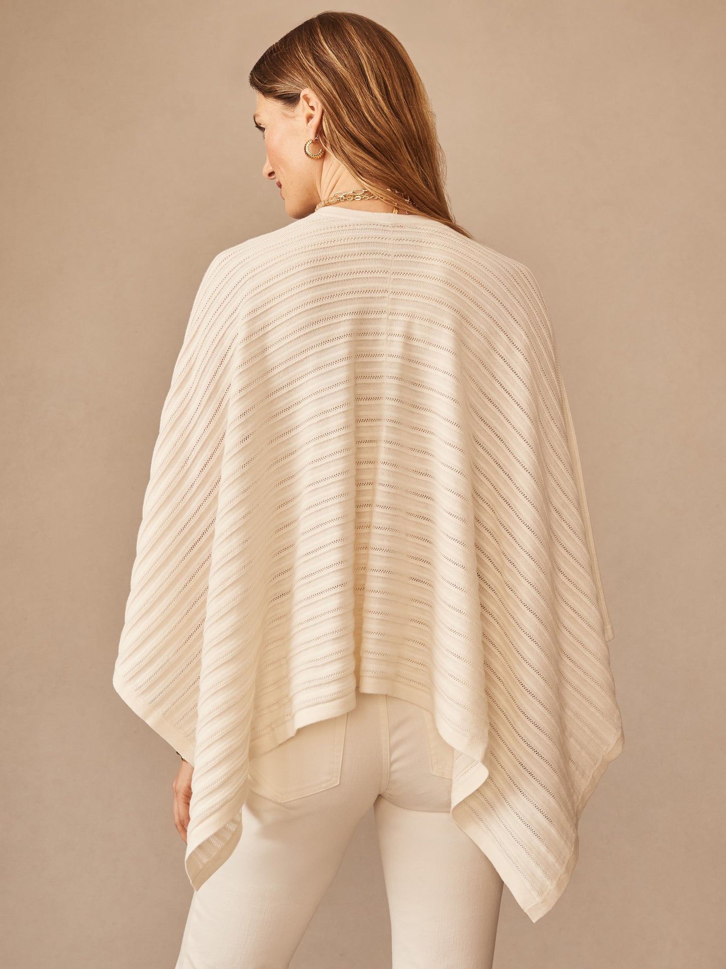 Back view of a woman wearing an ivory Penny Wrap by J.McLaughlin, showcasing effortlessly stylish, enduring designs in innovative fabrics, a destination for defining style. Life, Well-Lived.