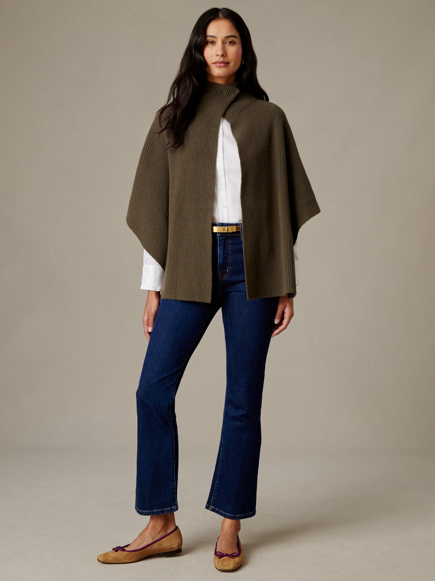 J.McLaughlin Philippa Cape in olive merino wool styled over a white blouse with dark jeans and flats for an effortlessly stylish timeless look