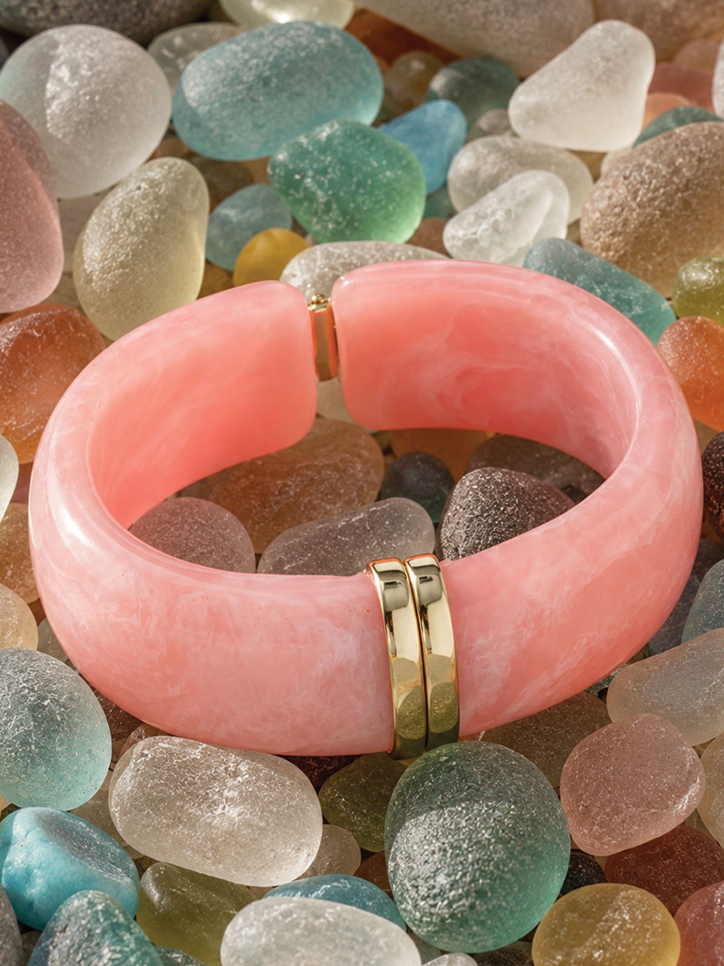 Resin Hinge Bangle by J.McLaughlin in soft pink with gold accents, showcasing effortlessly stylish and enduring designs, a destination for defining style. Life, Well-Lived.