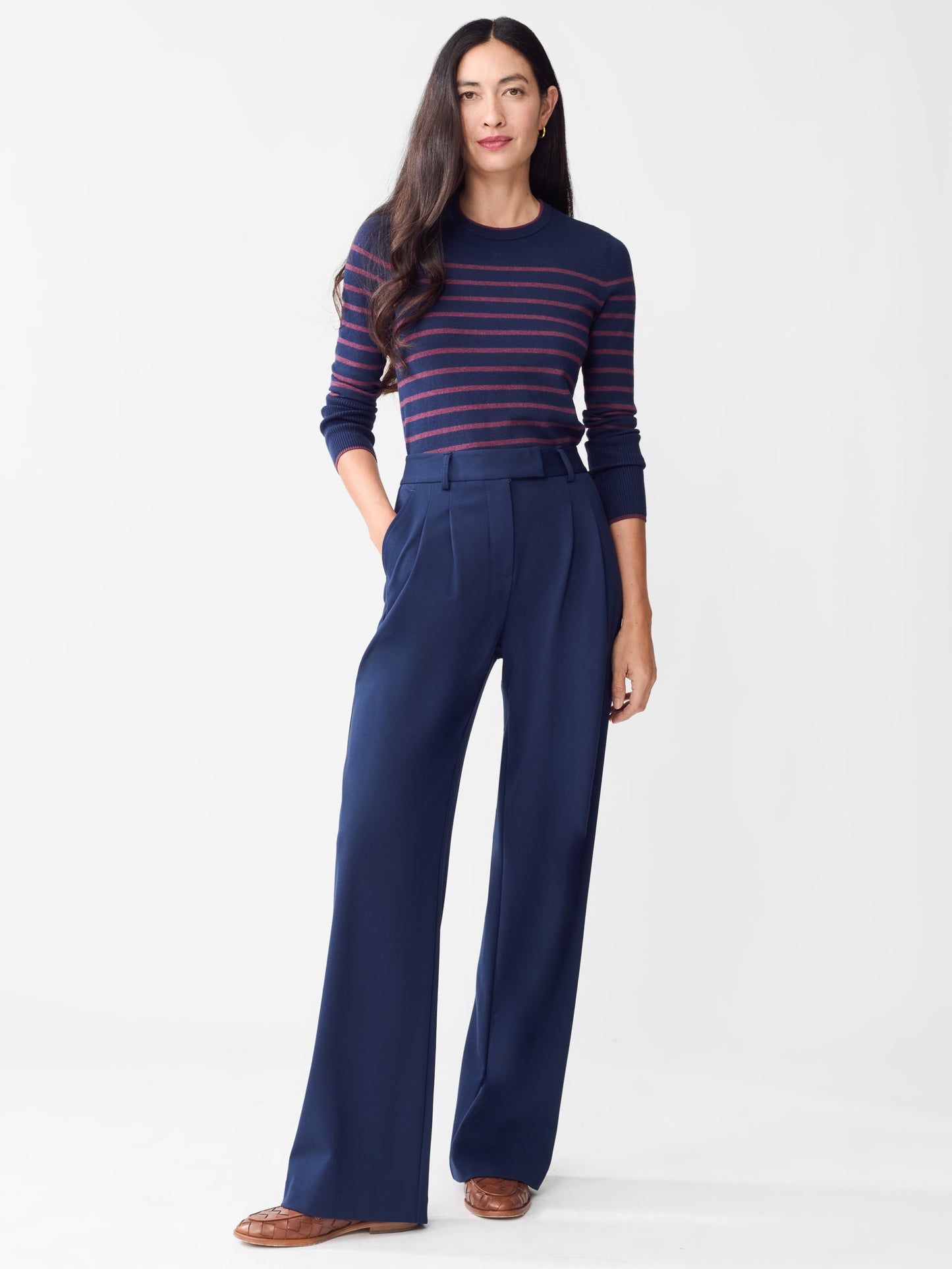 Model wearing J.McLaughlin Newman pants in winter navy made with rayon/nylon/spandex.