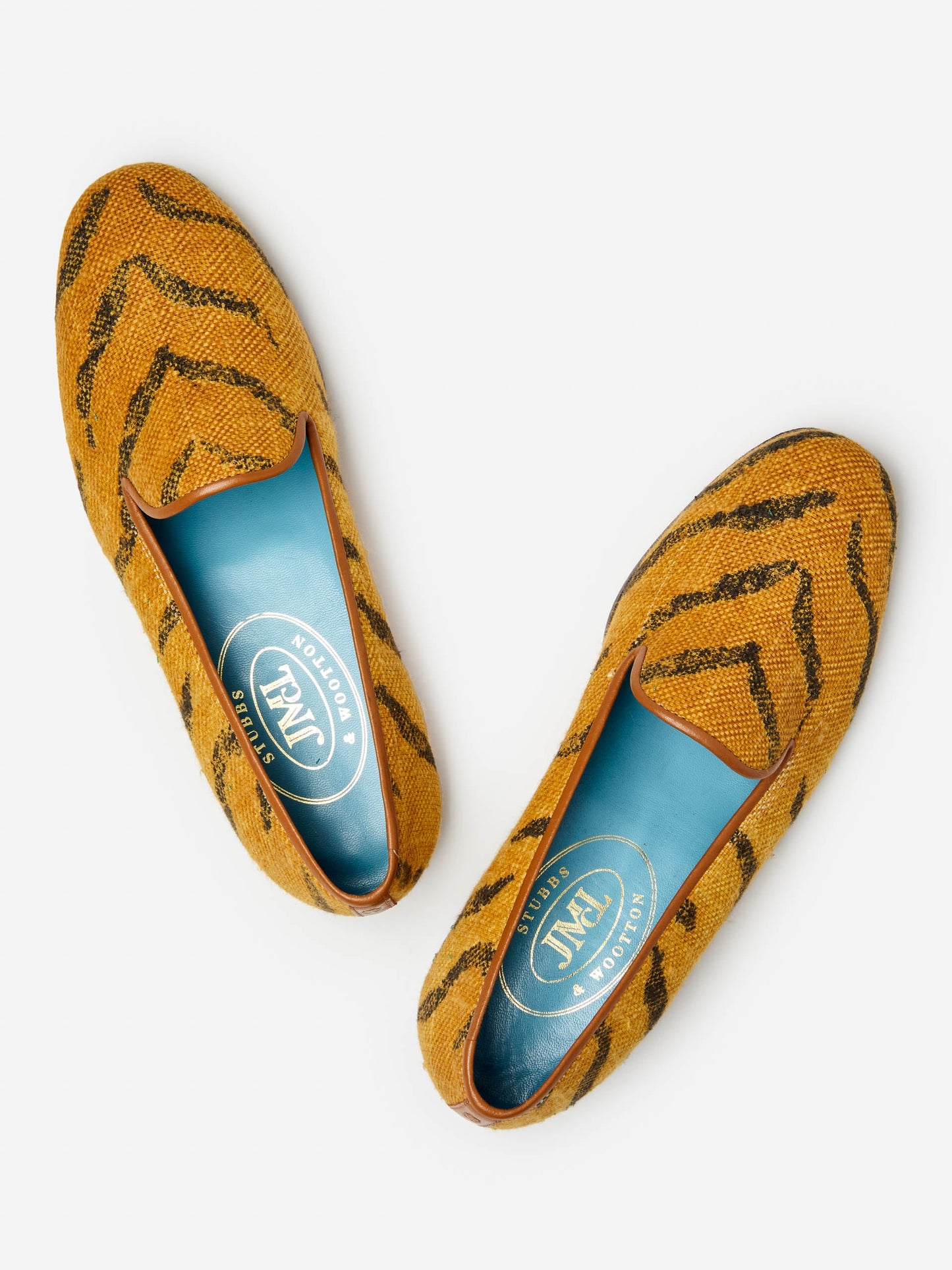 J.McLaughlin Slippers in tan made with upholstery fabric.
