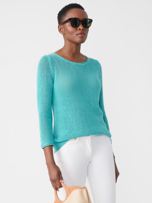 Model wearing J.McLaughlin Raelyn sweater in turquoise made with linen/cotton.