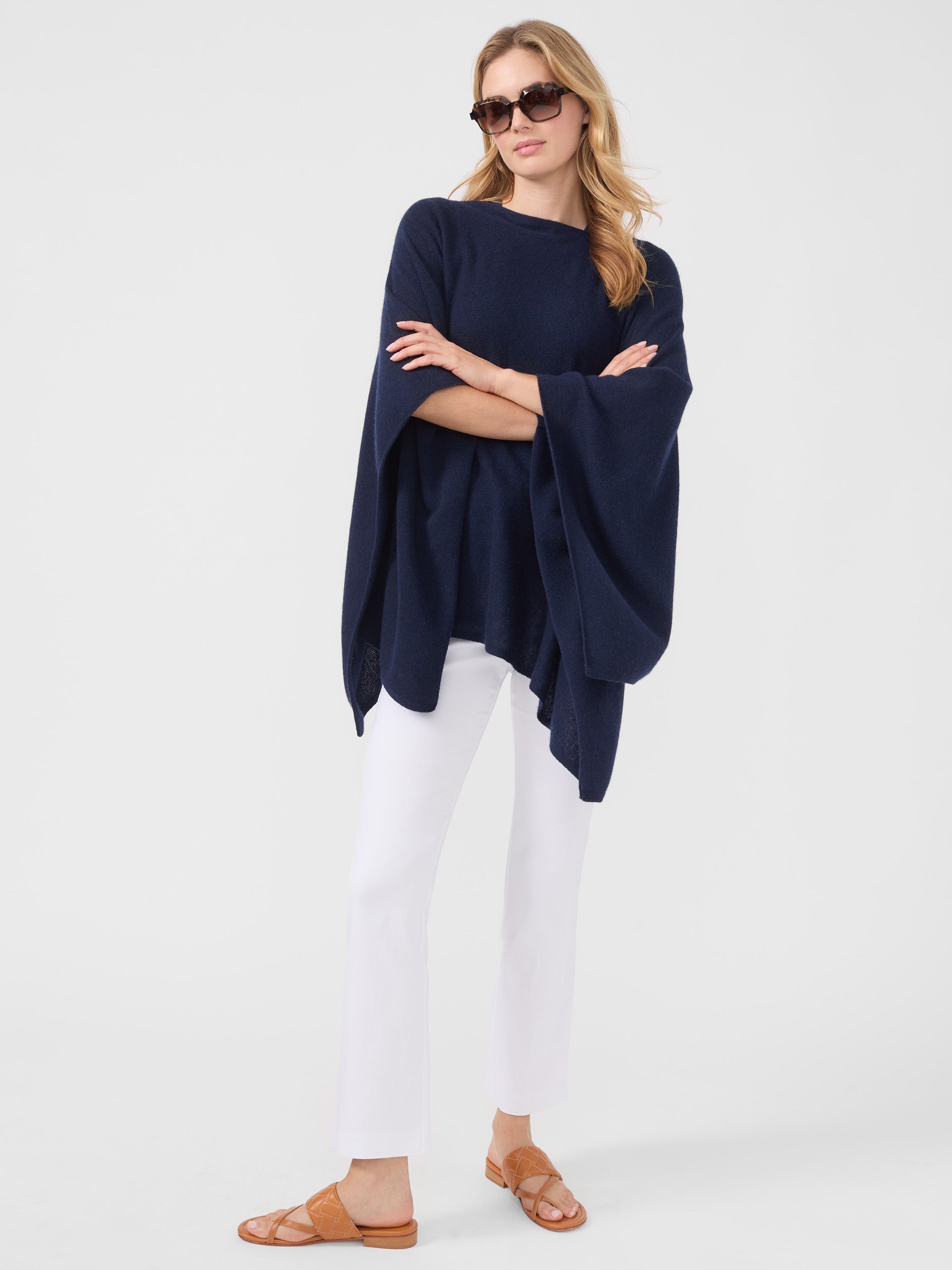 Model wearing J.McLaughlin Rale Poncho in Navy made with Cashmere.