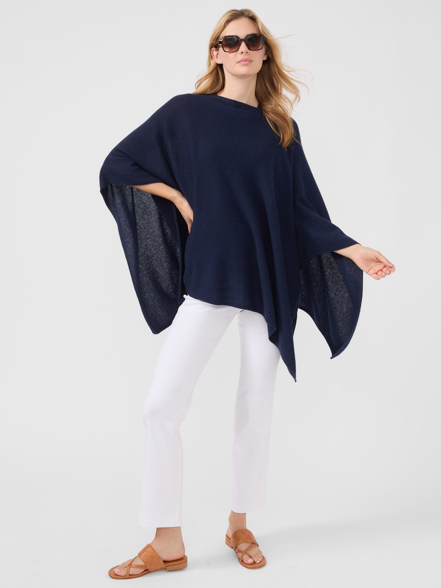 Model wearing J.McLaughlin Rale Poncho in Navy made with Cashmere.