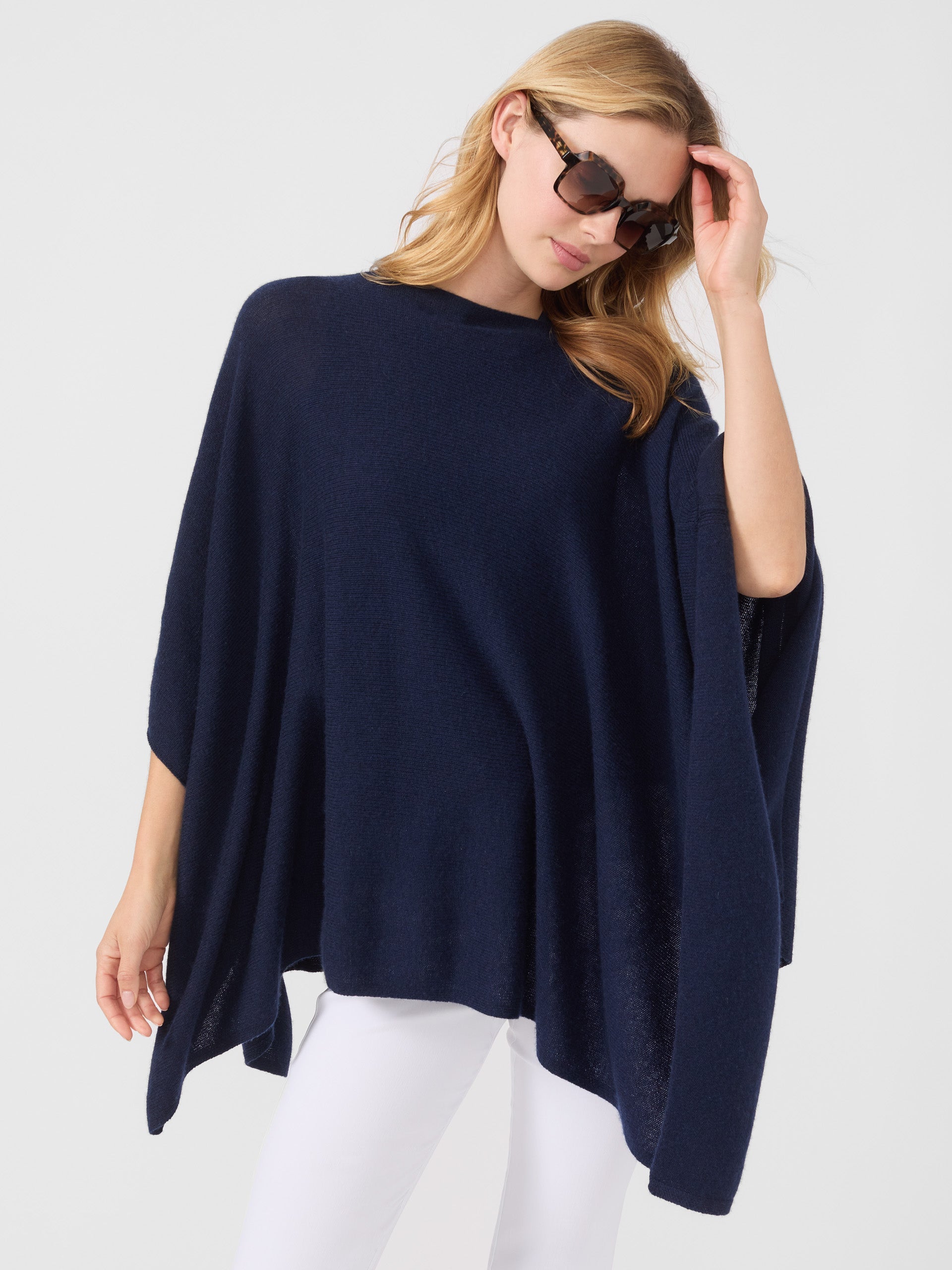 Model wearing J.McLaughlin Rale Poncho in Navy made with Cashmere.