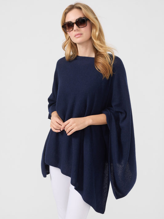 Model wearing J.McLaughlin Rale Poncho in Navy made with Cashmere.