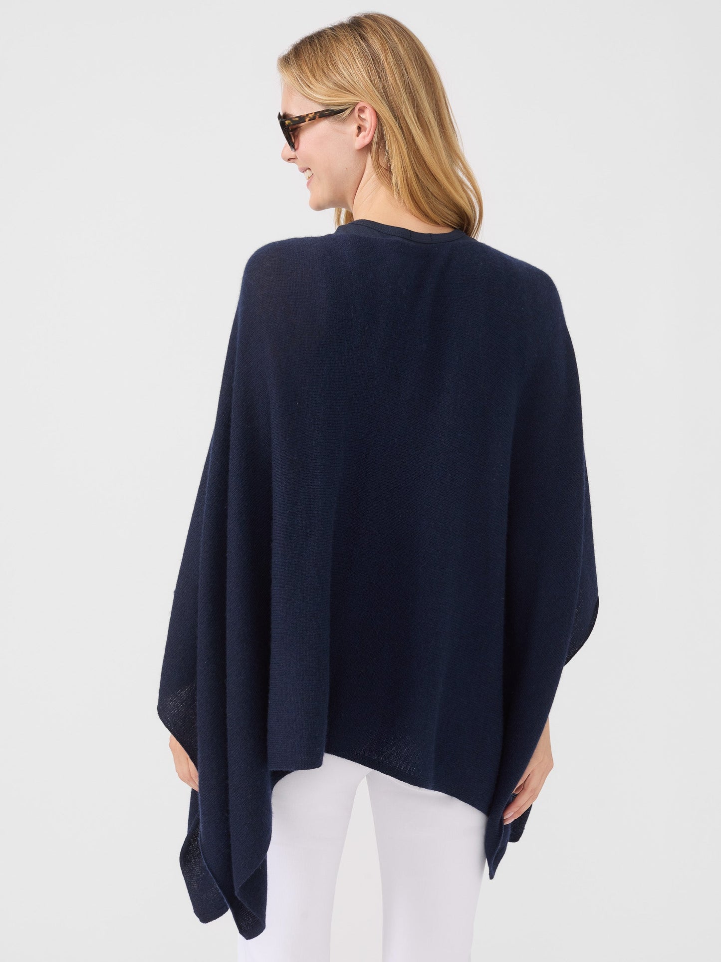 Model wearing J.McLaughlin Rale Poncho in Navy made with Cashmere.