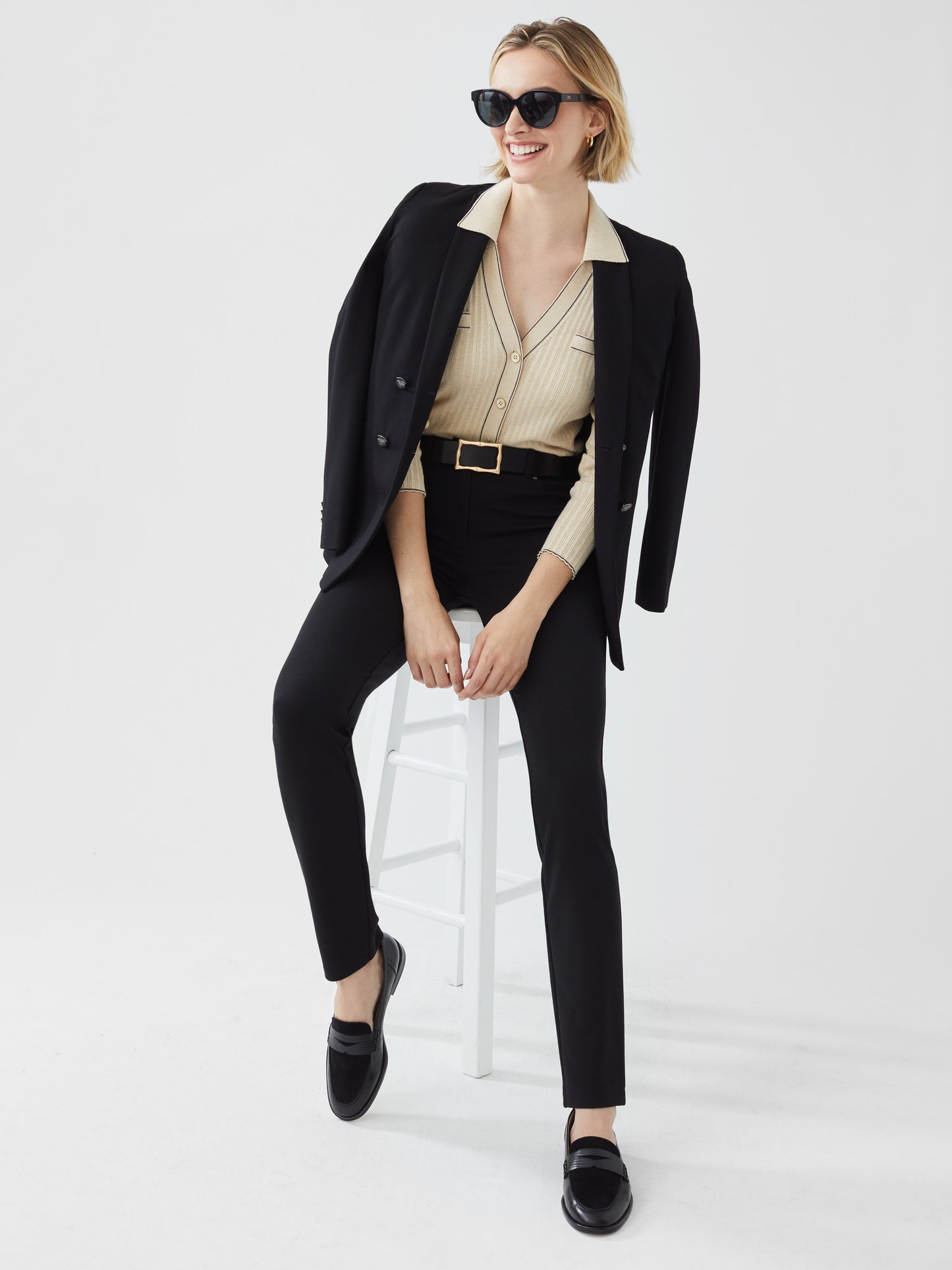 Model wearing J.McLaughlin Rebecca pants in black made with Bainrbridge cloth.