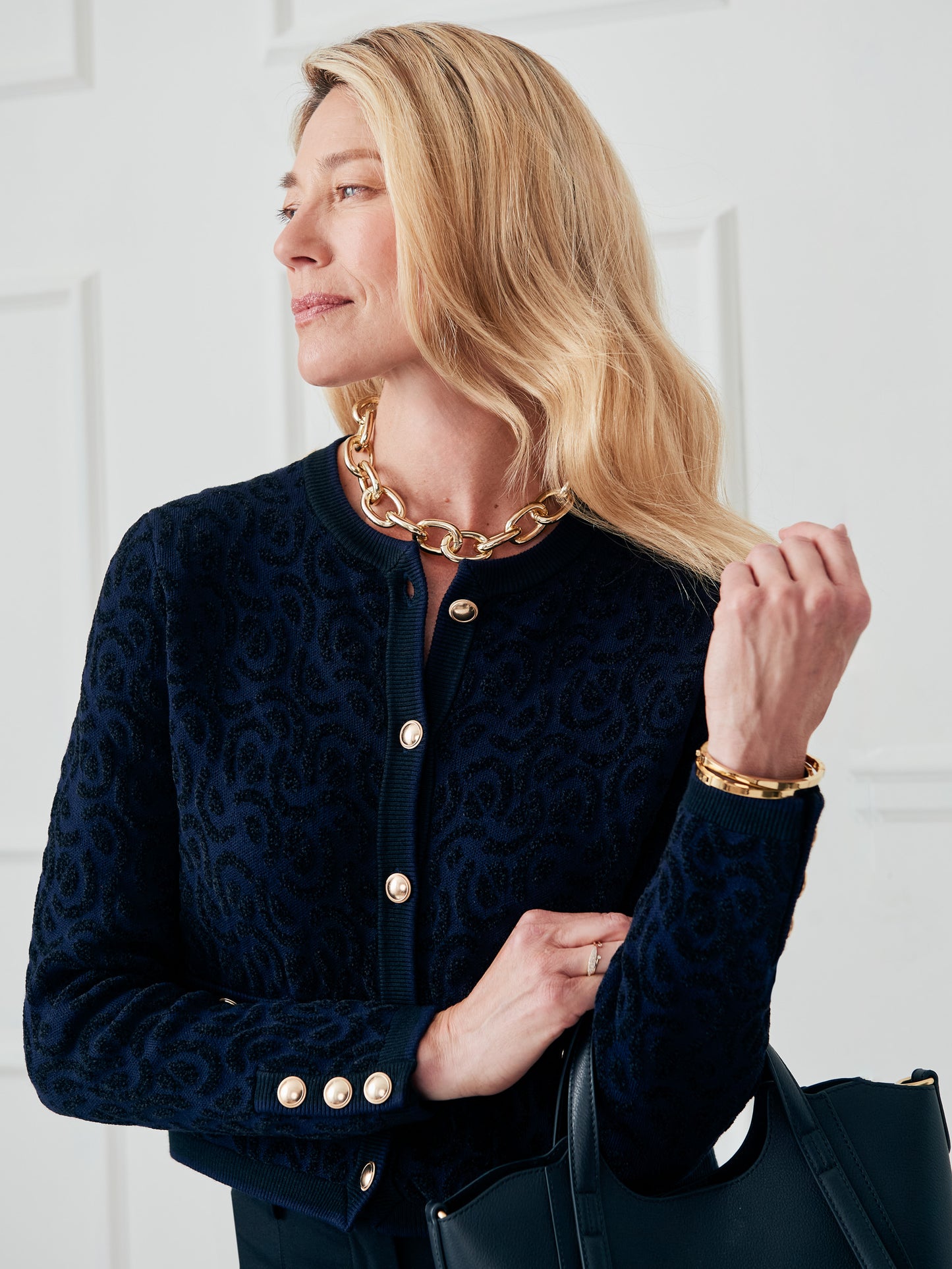 J.McLaughlin Reva sweater in black/navy made with polyester. 