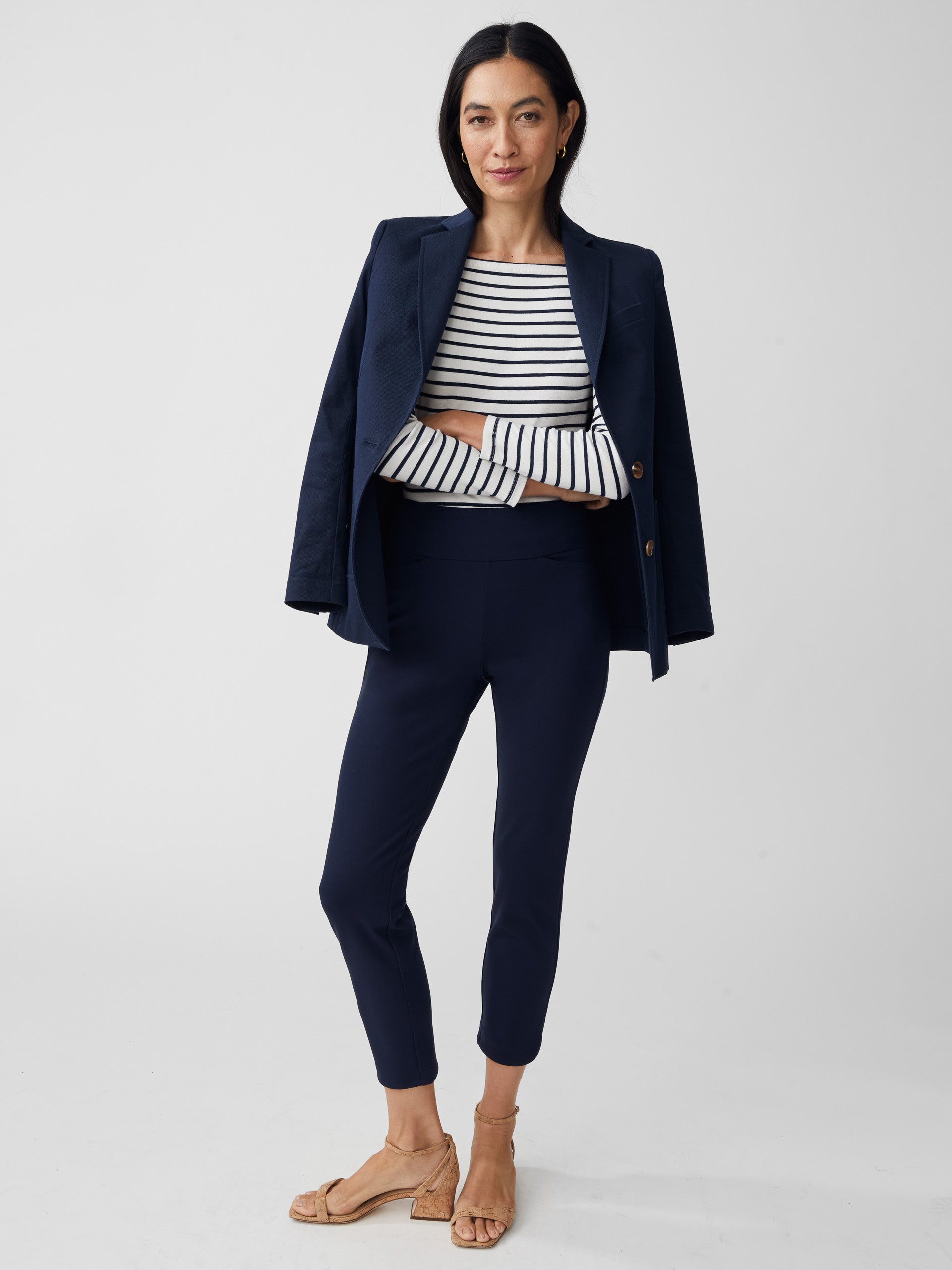 Model wearing J.McLaughlin Romilly pants in winter navy made with bainbridge fabric.