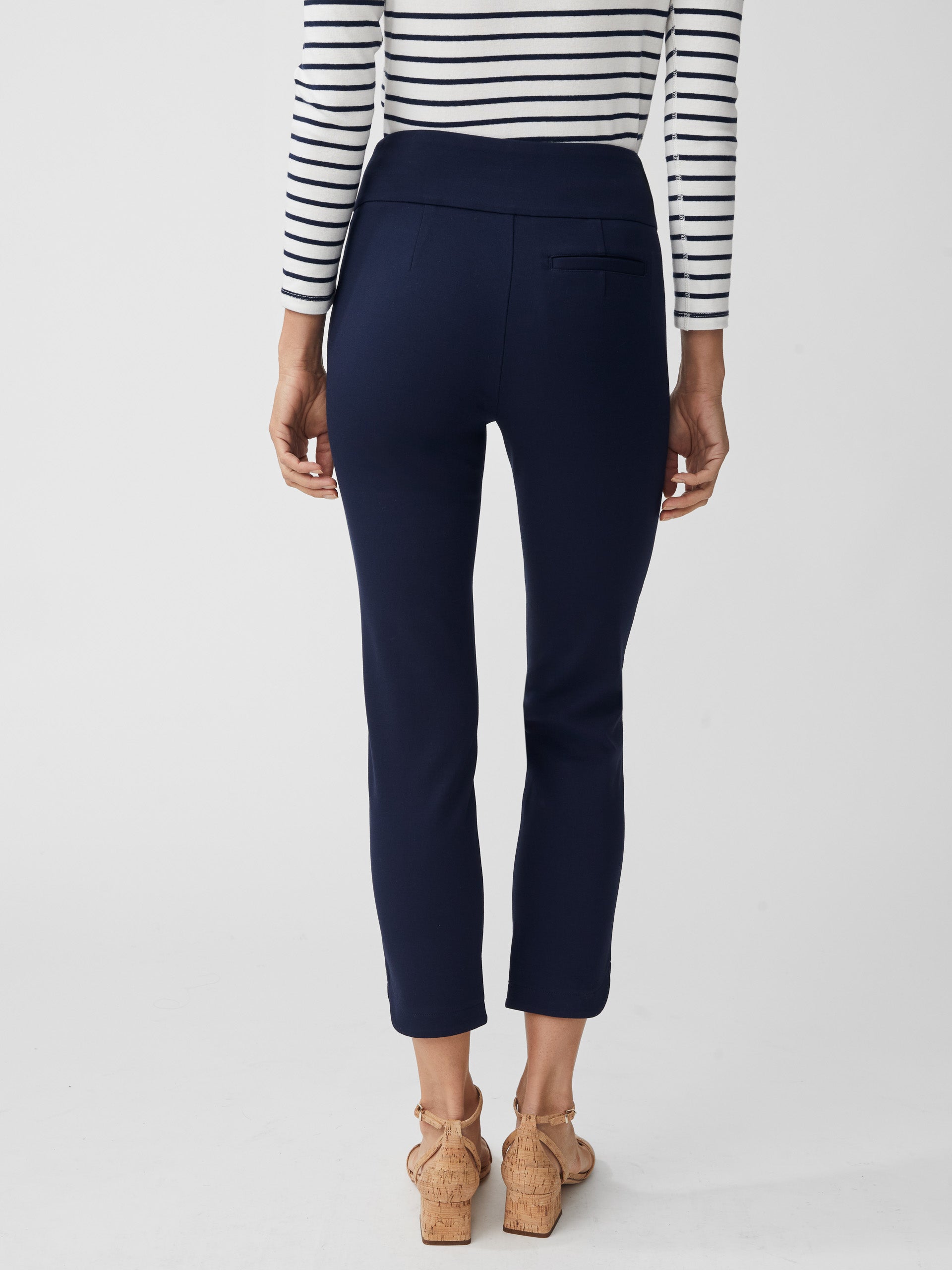 Model wearing J.McLaughlin Romilly pants in winter navy made with bainbridge fabric.