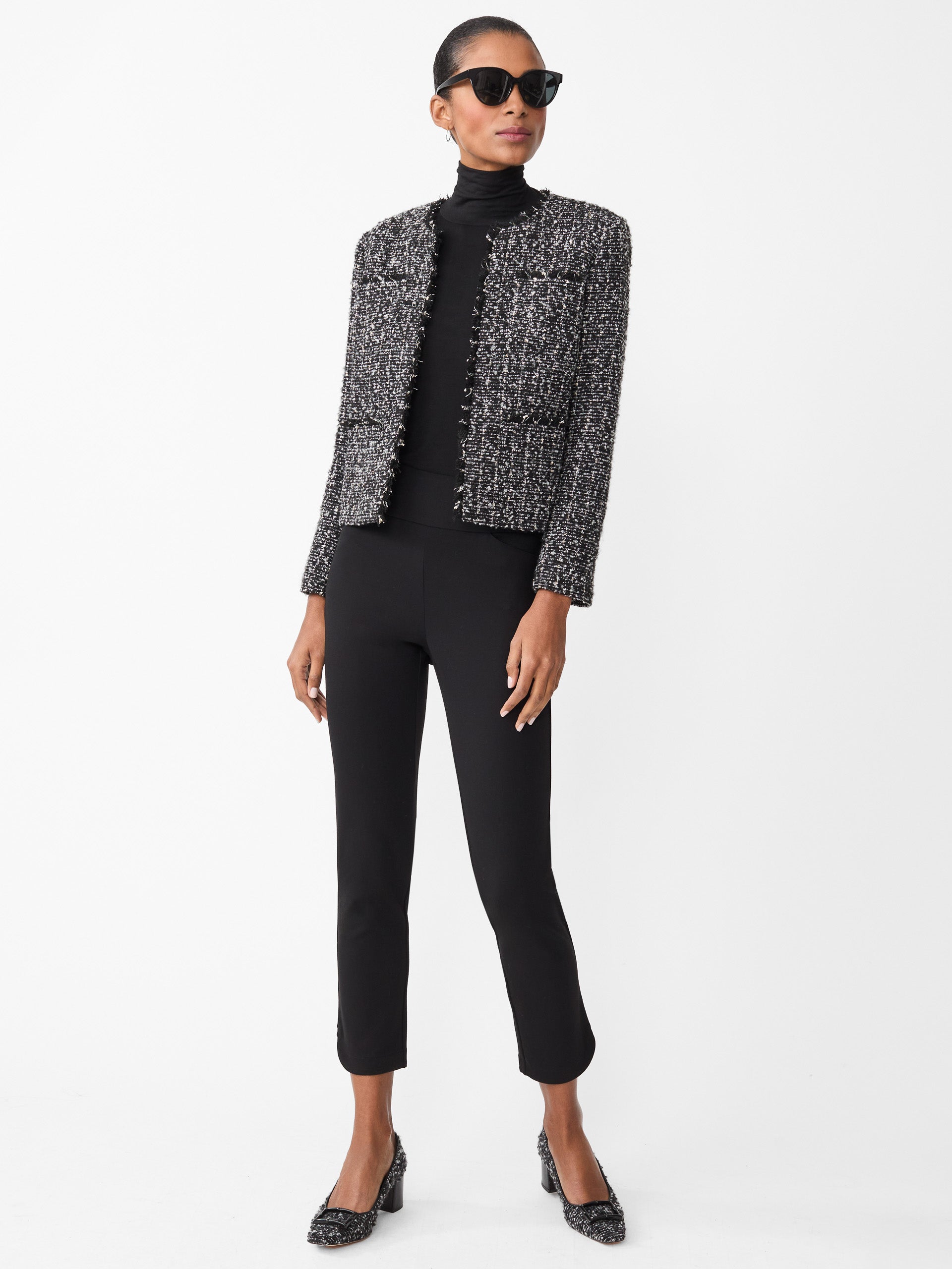 Model wearing J.McLaughlin Romilly pants in black made with Bainbridge fabric.