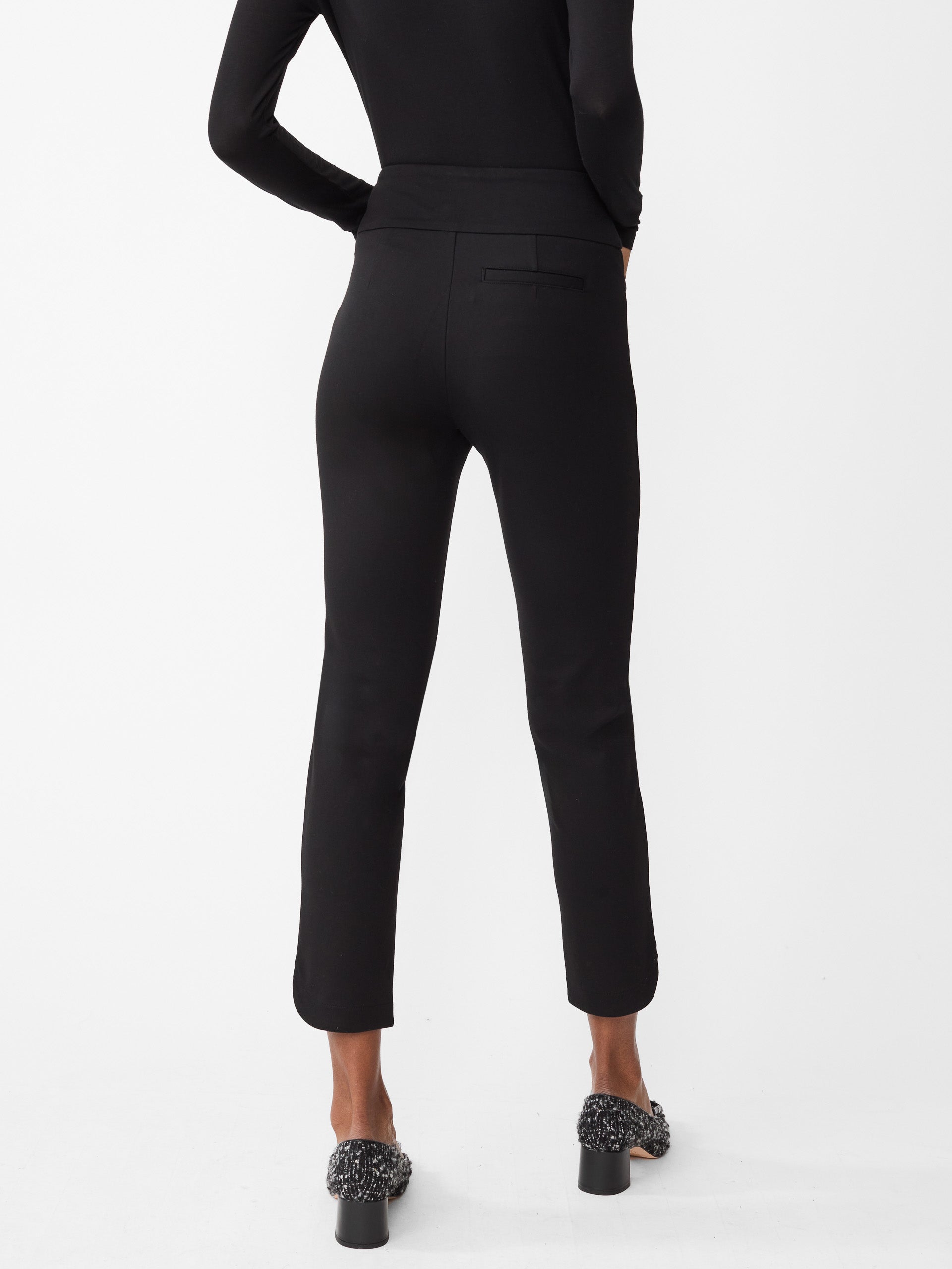 Model wearing J.McLaughlin Romilly pants in black made with Bainbridge fabric.