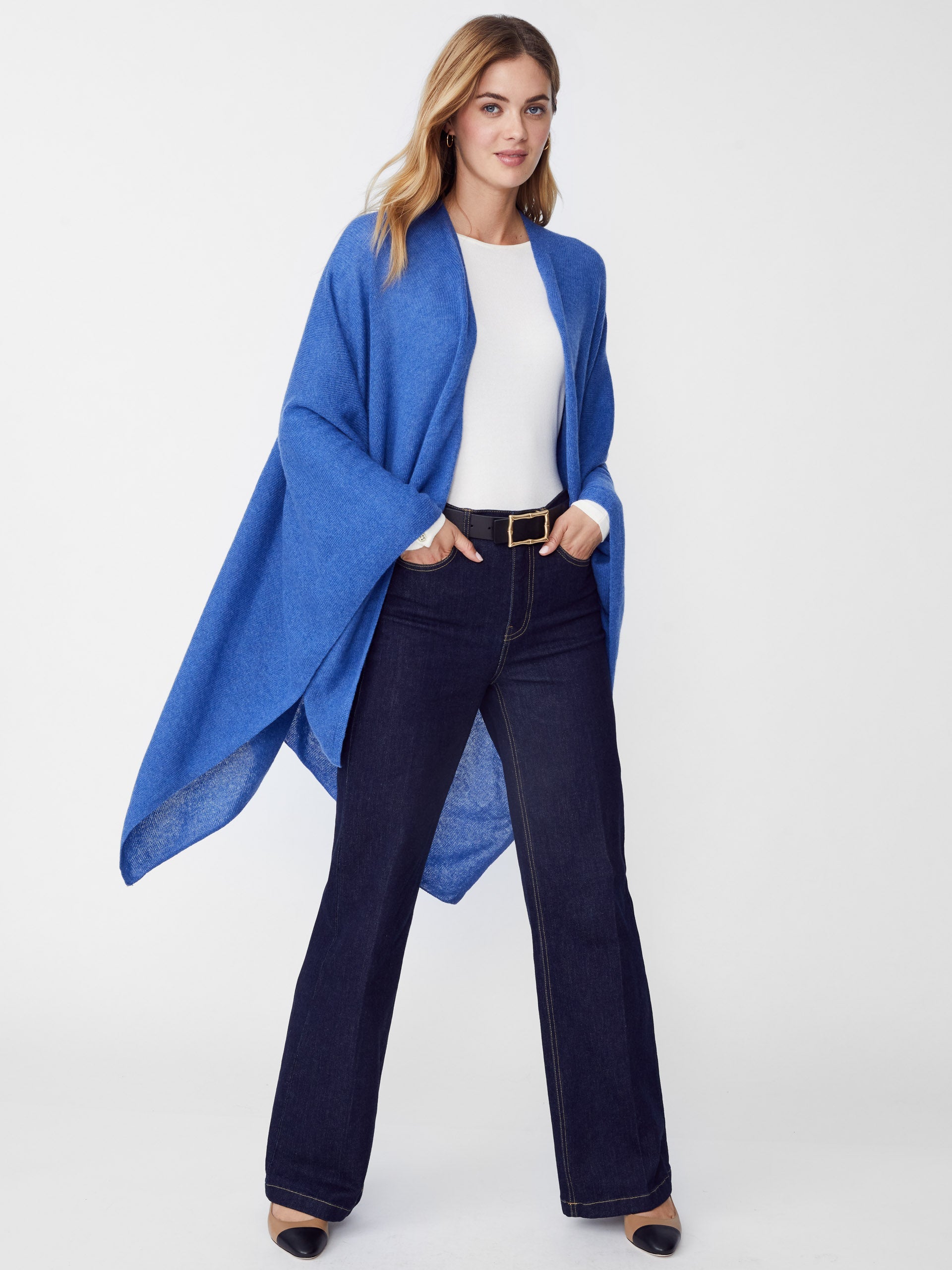 Model wearing J.McLaughlin Rossi wrap in blue made with cashmere.