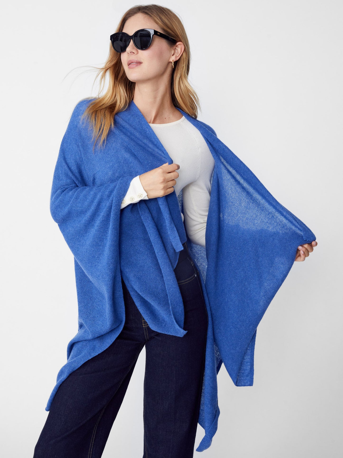 Model wearing J.McLaughlin Rossi wrap in blue made with cashmere.