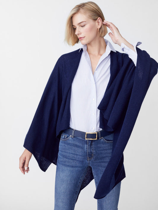 Model wearing J.McLaughlin Rossi wrap in navy made with cashmere.