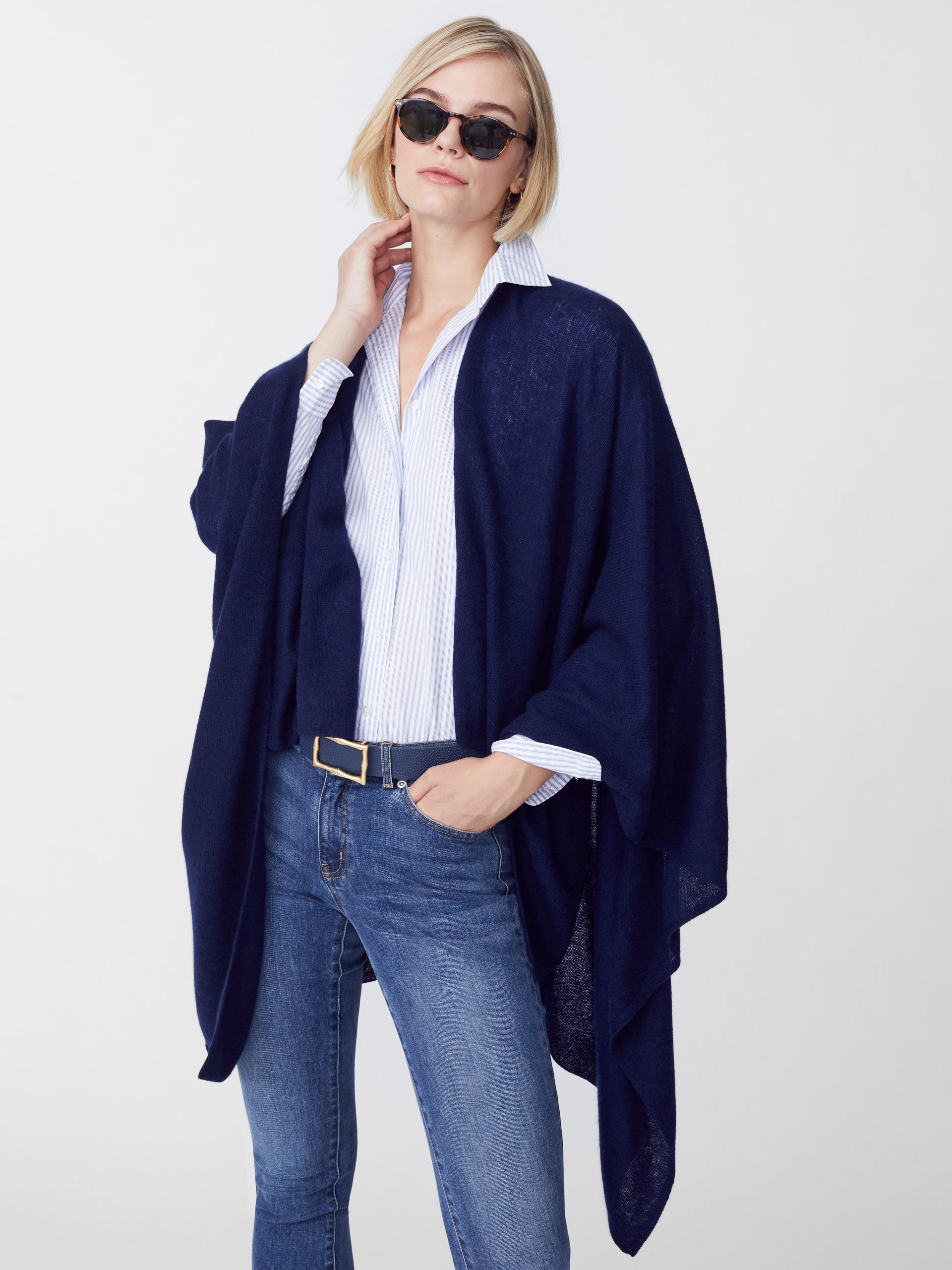 Model wearing J.McLaughlin Rossi wrap in navy made with cashmere.